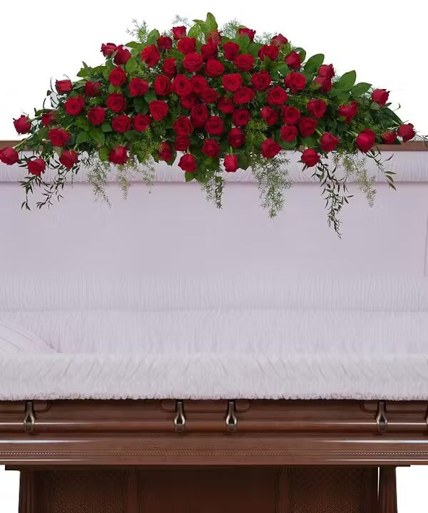 ROYAL ROSE FULL CASKET SPRAY - Beautiful red roses designed with premium foliage are combined to make this elegant spray.  
