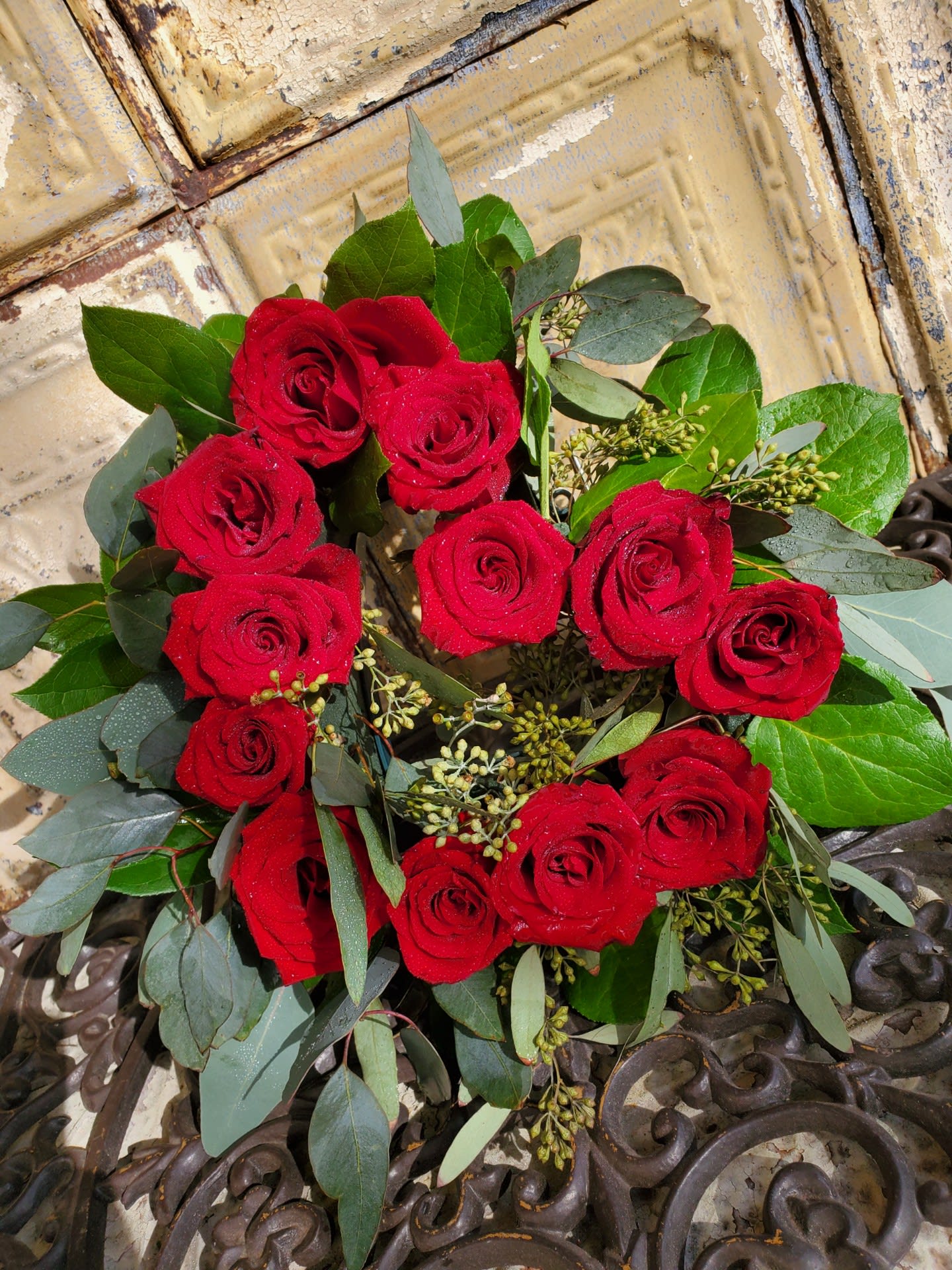 Bouquet of red roses with eucalyptus and greenery