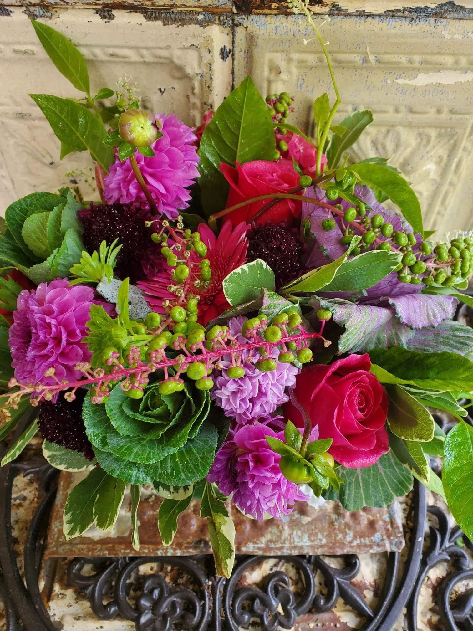 Bouquet of pink and purple flowers with green foliage