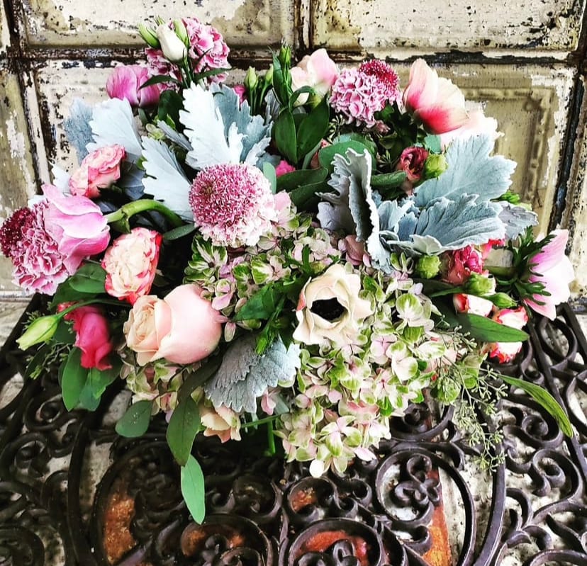 Barbie - A beautiful arrangement that matches her name featuring hydrangeas, roses, ranunculus, scabiosa, dusty miller, anemone, and lisianthus. 