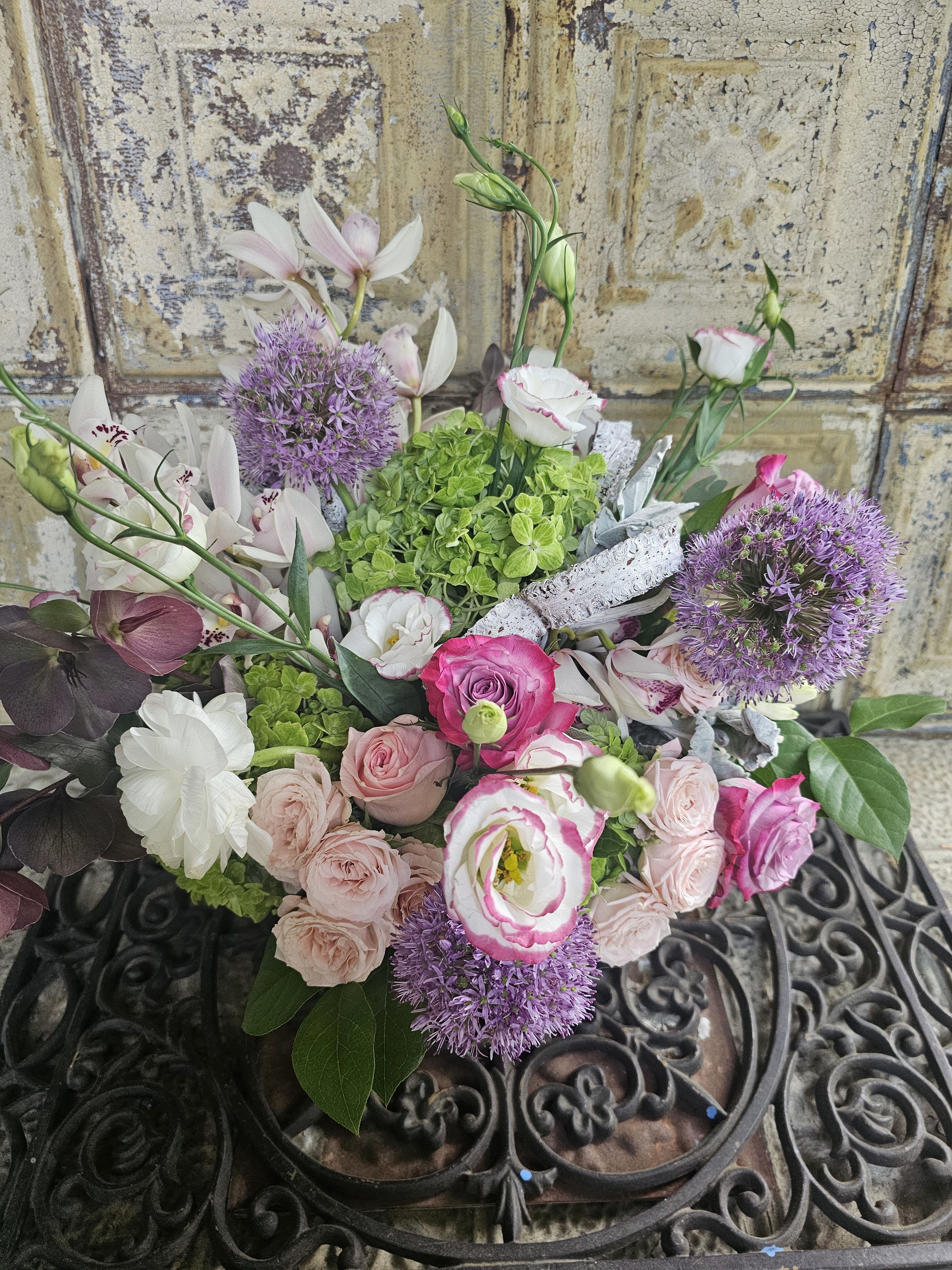 Mixed bouquet of pink and white flowers with purple blooms