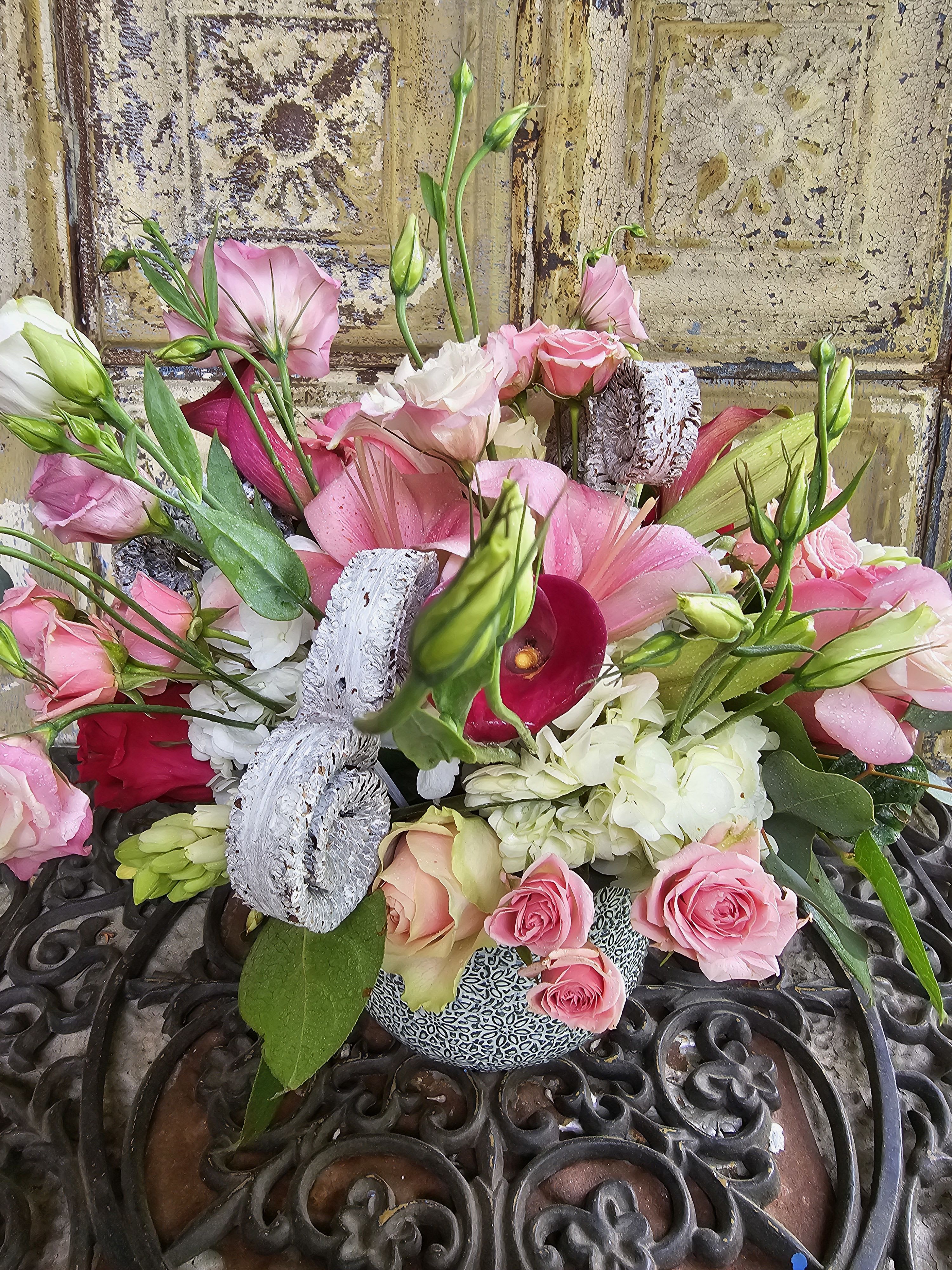 Pink and white mixed bouquet with roses, lilies, and calla lilies