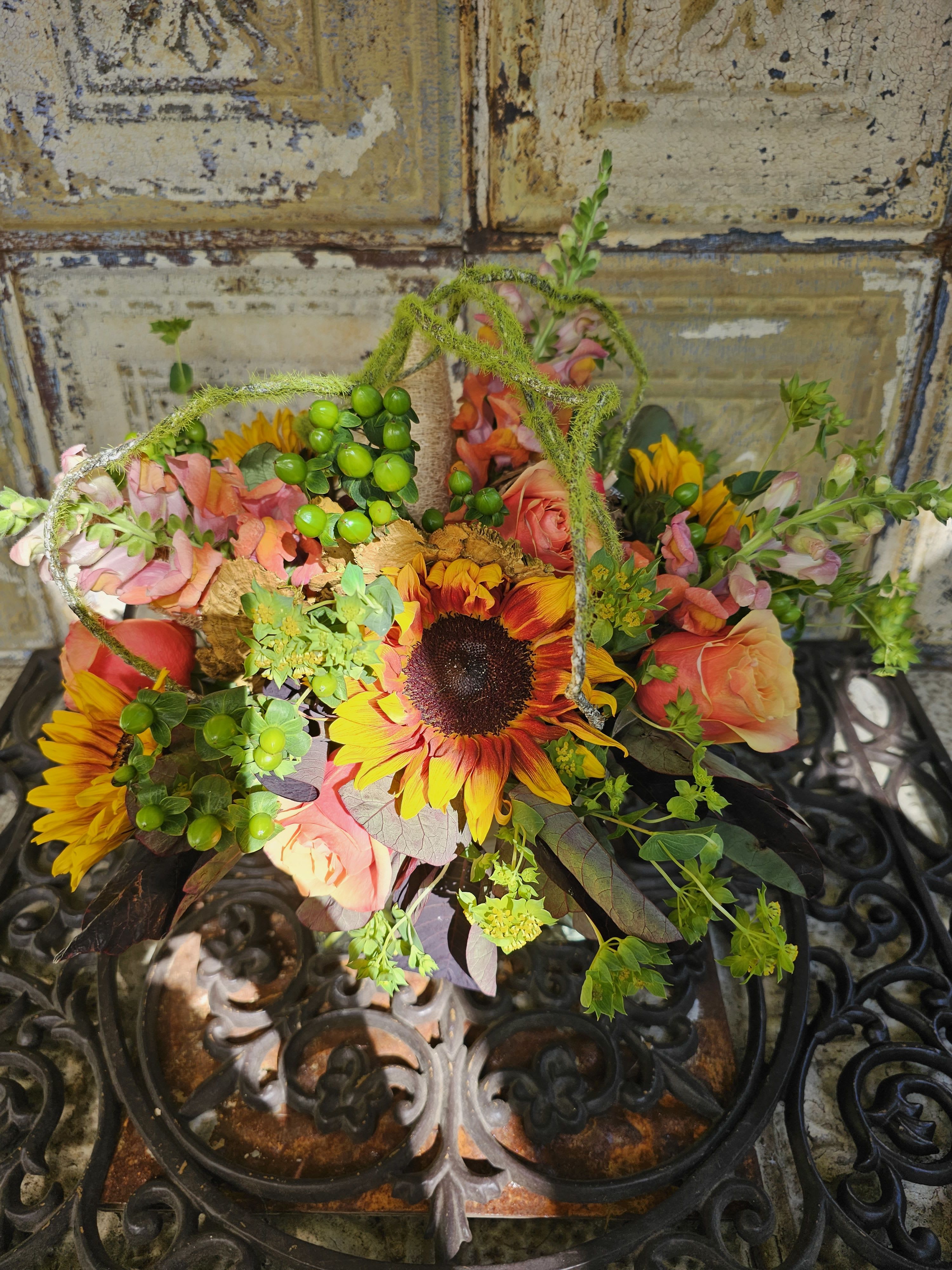 Mixed bouquet with sunflowers and peach roses