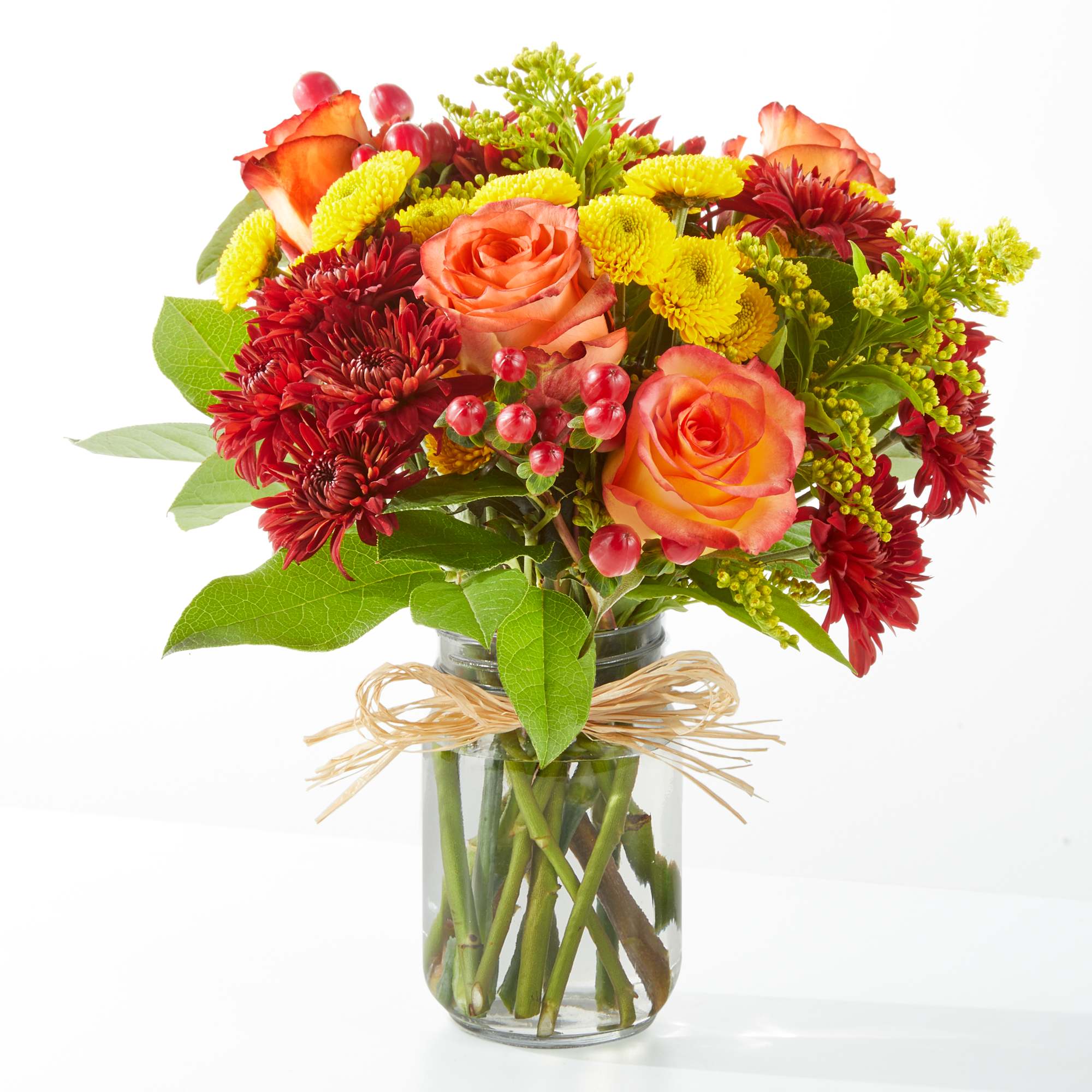 Apple Picking - Bring the fall festivities indoors with the Apple Picking Bouquet, a delicious mix of roses, mums, and solidago expertly arranged in a mason jar capturing the beauty of the season.