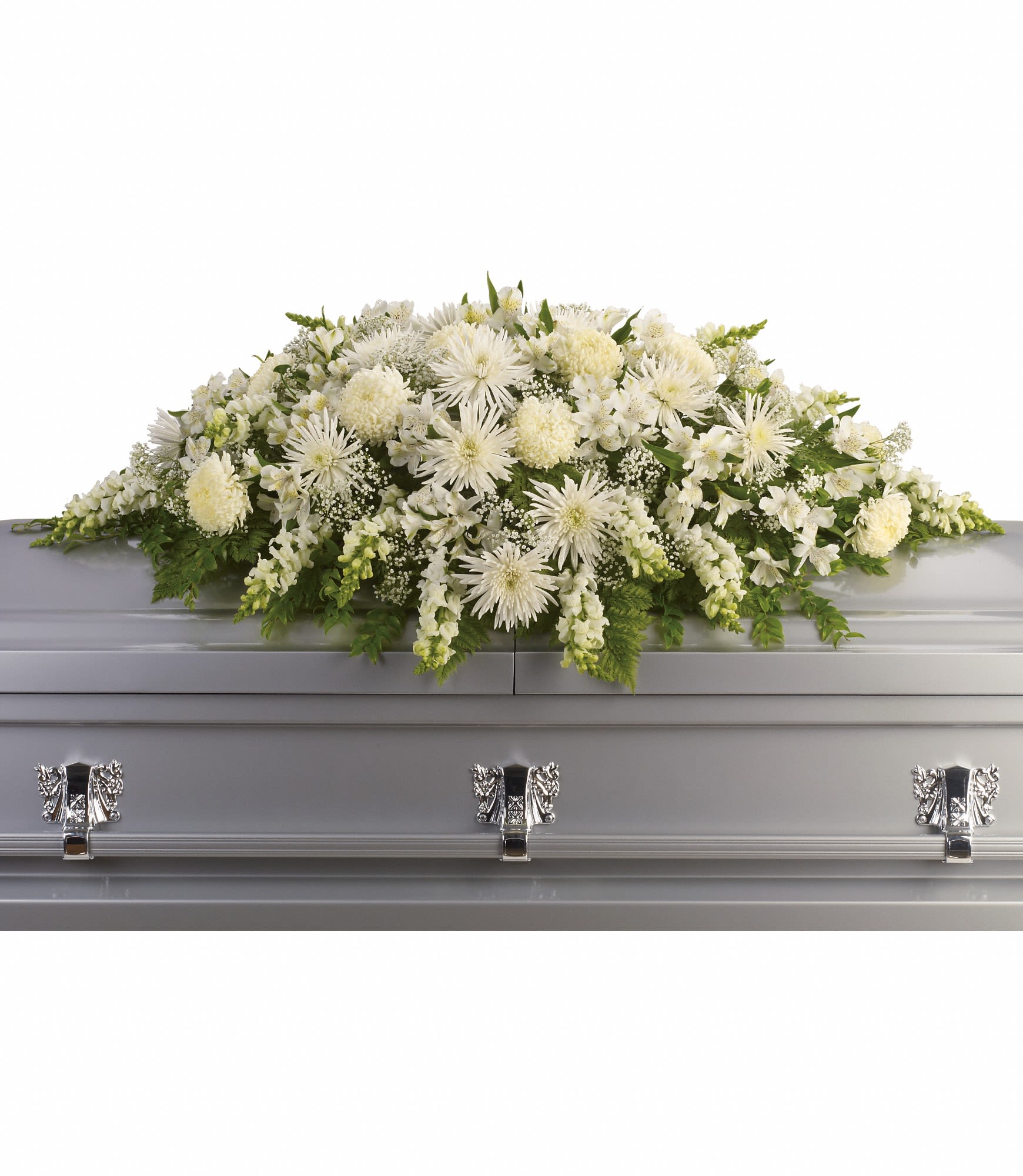 White floral casket spray with mixed blooms on a silver casket