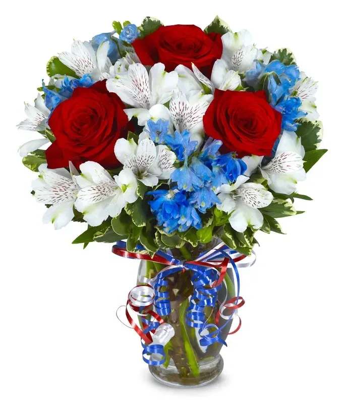 Red-White-Blue - Celebrate your country with a bright red, white and blue floral bouquet! This wonderful patriotic arrangement is the perfect centerpiece for a Summer picnic or for a fun gift. Hand arranged with fresh red roses, white alstroemeria and blue flowers. Please Note: The bouquet pictured reflects our original design for this product. While we always try to follow the color palette, we may replace stems to deliver the freshest bouquet possible, and we may sometimes need to use a different vase.