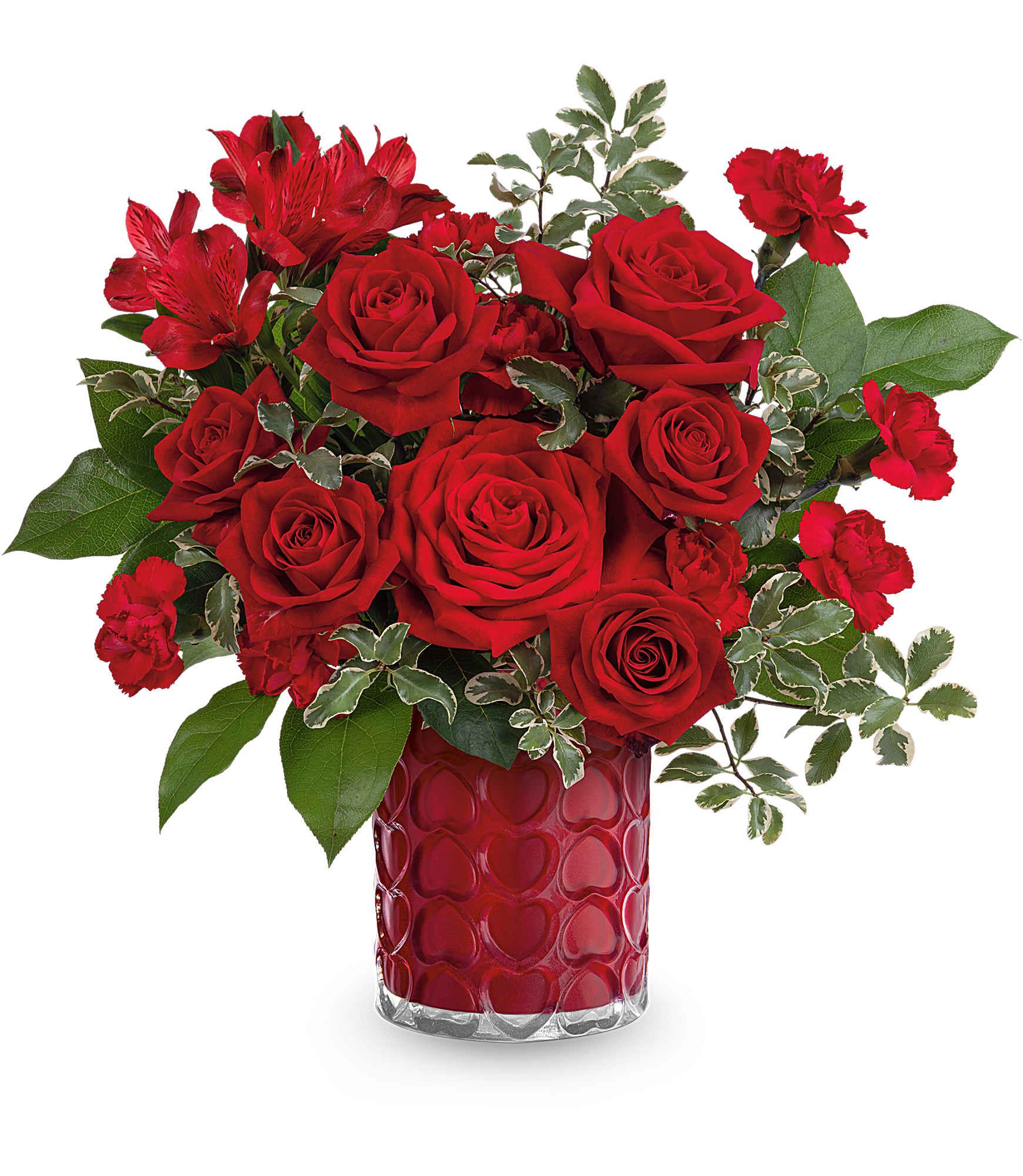 Red roses and carnations in a red heart-patterned vase