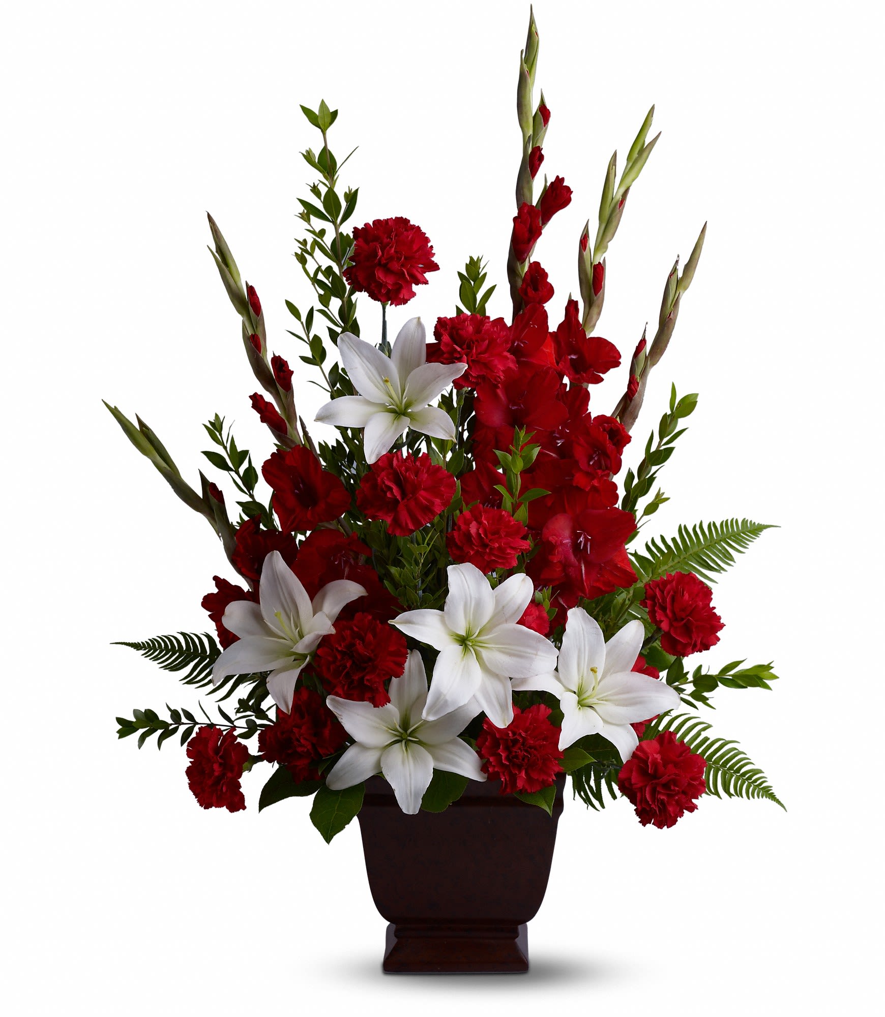 Red carnations and white lilies arranged in a dark vase