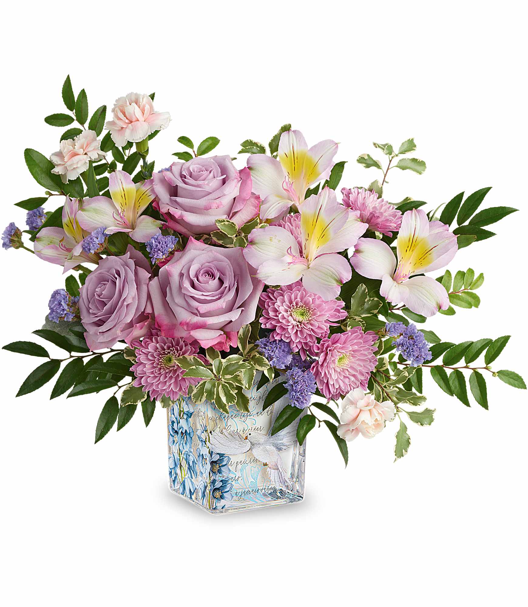 Written In The Sky Bouquet - Peaceful and poetic, Our Written In The Sky Bouquet inspires serenity with lavender roses and soft pastel blooms arranged in a glass cube adorned with delicate flowers and a graceful dove design.