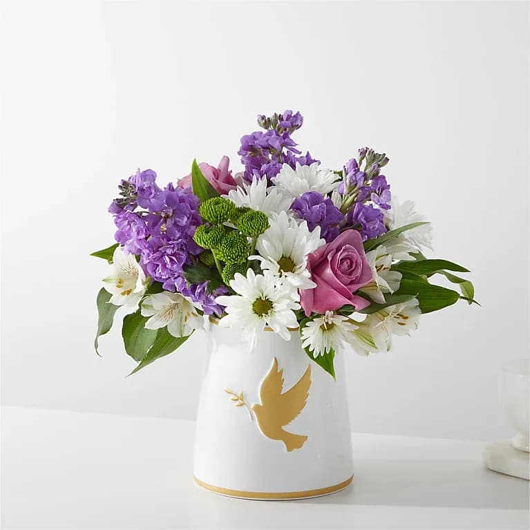 Garden of Peace Bouquet - Through the lush lavender and white stems of the Garden of Peace Bouquet, offer your recipient a moment of tranquility when they need it most. This bouquet is designed by a local florist, and is best fit for a home or residence.