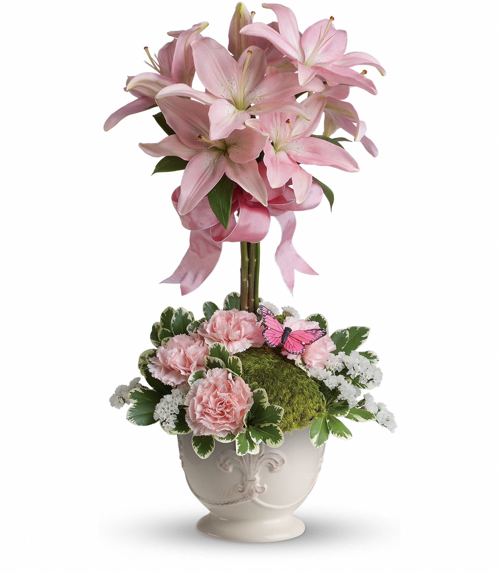 Blushing Lilies - Like springtime in Paris, this flirtatious topiary makes romance bloom! She'll adore the pale pink lilies, a pretty pink ribbon, and charming french country pot as well as the loving sentiment that comes with it!