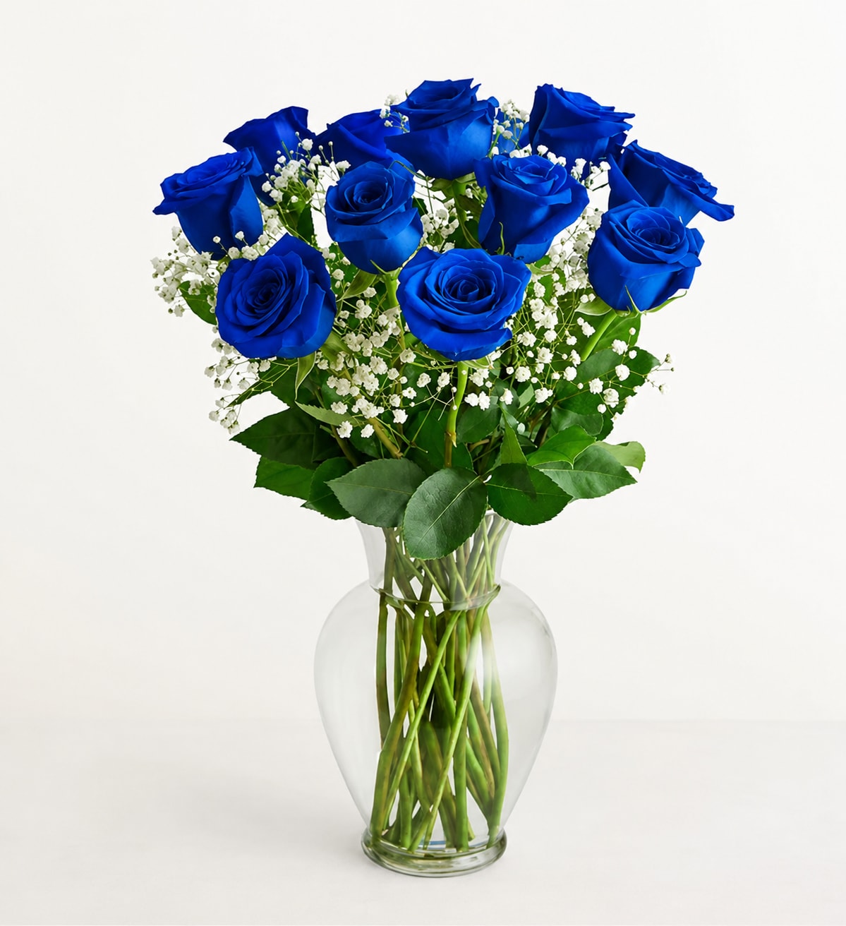 Dozen Blue Roses with Baby Breath - Our premium long stem blue roses are an elegant surprise for the one you can trust, the one you can turn to, the one you love with all your heart. Beautifully arranged by our expert florists with lush greenery inside a classic glass vase, 12 or 18 radiant blooms are hand-delivered and ready to delight them for any ocasion.