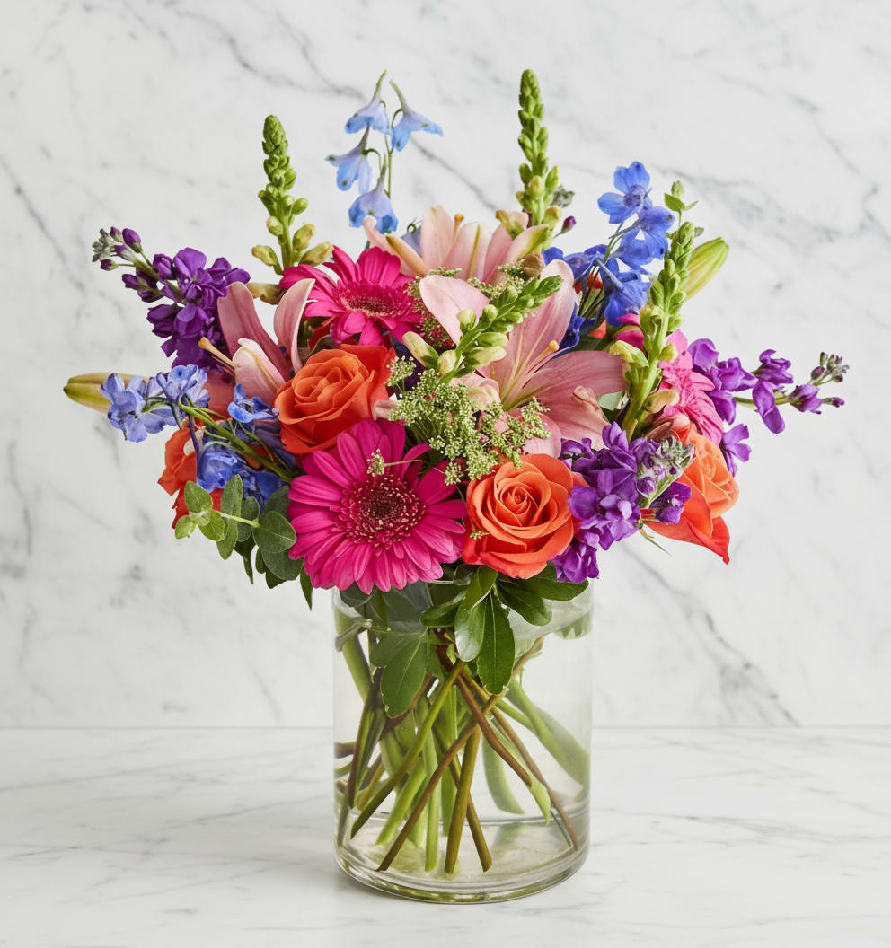 Colorful mixed bouquet in a clear glass vase