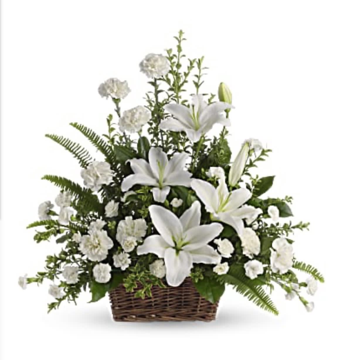 White lilies and carnations in a wicker basket