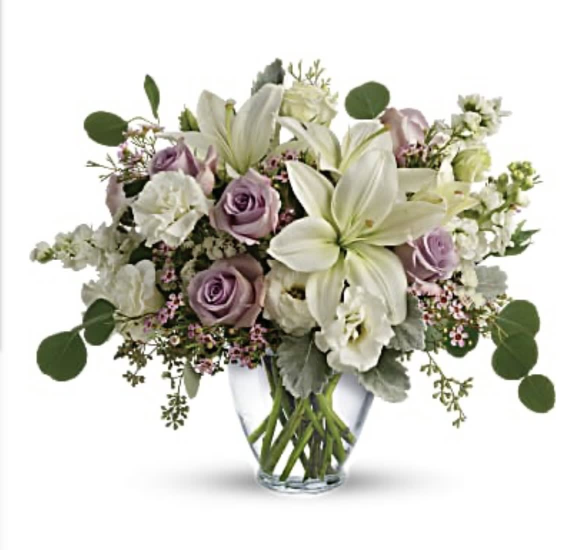 Lavender roses and white lilies in a clear glass vase