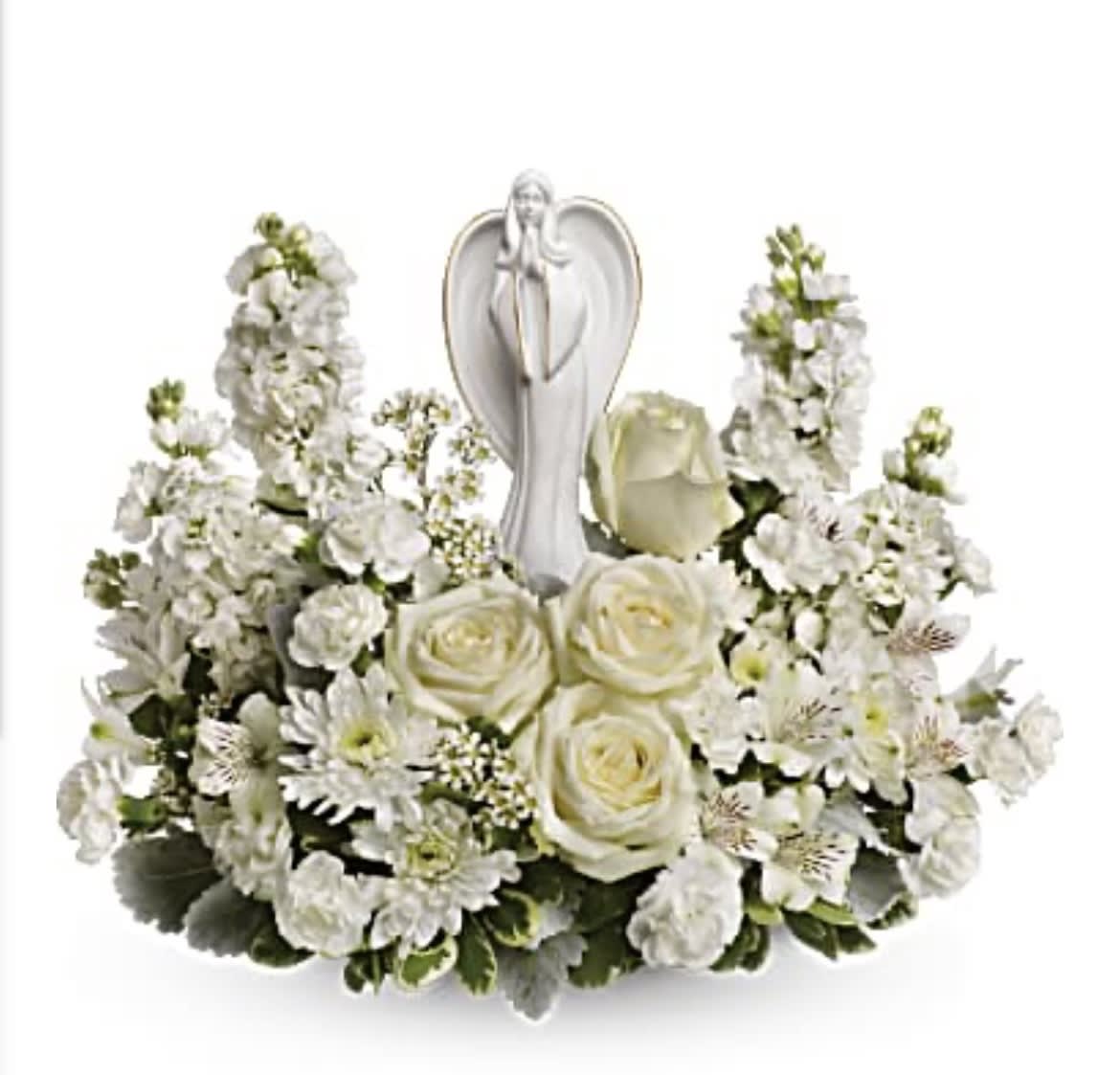 White floral arrangement with roses and a praying angel figurine