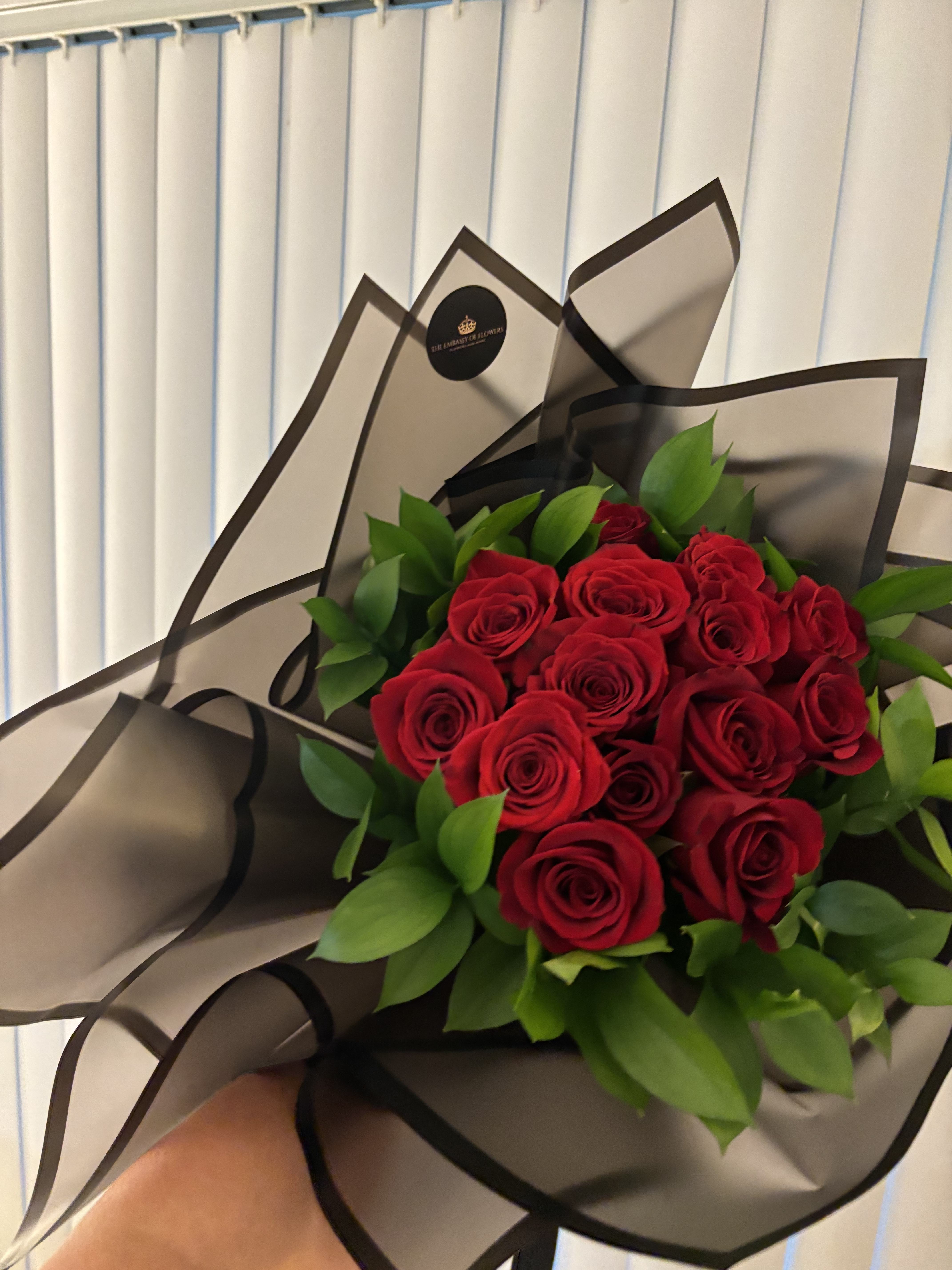 12 Roses , wrapped Bouquet  - Beautiful fresh roses, wrapped in Korean-style paper. You may request your favorite rose and paper colors; the roses can be red, pink, white, or purple, and the paper can be red, black, pink, or white.
