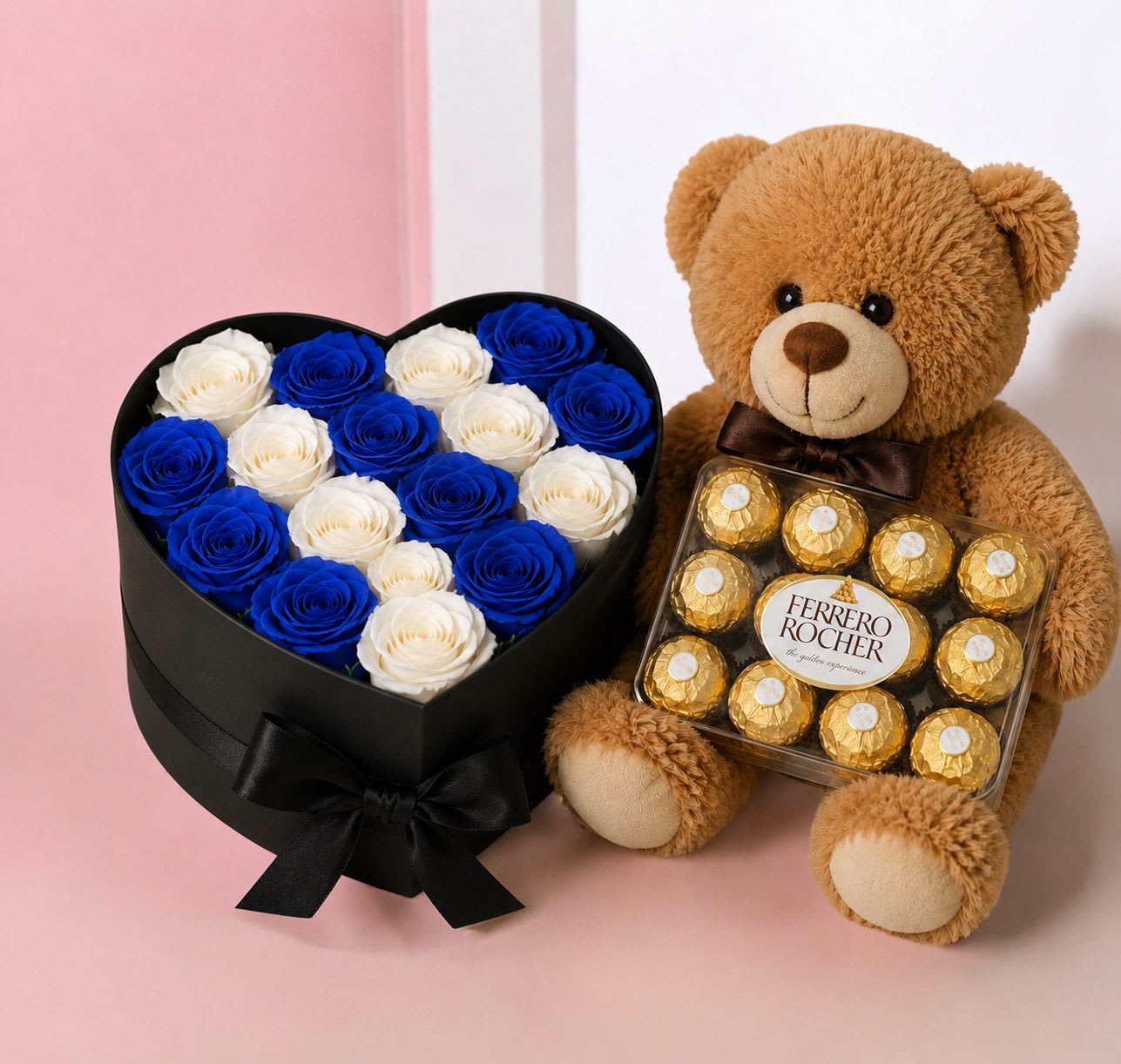 Combo – Blue &amp; White Heart Box - Celebrate Dad with a thoughtful and elegant gift designed to make him feel truly special. This beautiful Father's Day combo includes a charming 10-inch teddy bear, a small box of Ferrero Rocher chocolates, and a stunning heart-shaped box filled with fresh blue and white roses.  Perfect for expressing love, gratitude, and appreciation, this unique arrangement combines sweetness, beauty, and a touch of luxury.  Includes:  Heart-shaped box with fresh blue and white roses 10-inch teddy bear Small Ferrero Rocher chocolates Complimentary message card  Flower shades may vary slightly based on seasonal availability while maintaining the overall style and color palette.  A memorable Father's Day gift made with love by The Embassy of Flowers. 