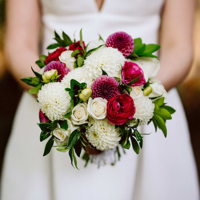 Bride holding a bouquet of white and pink flowers