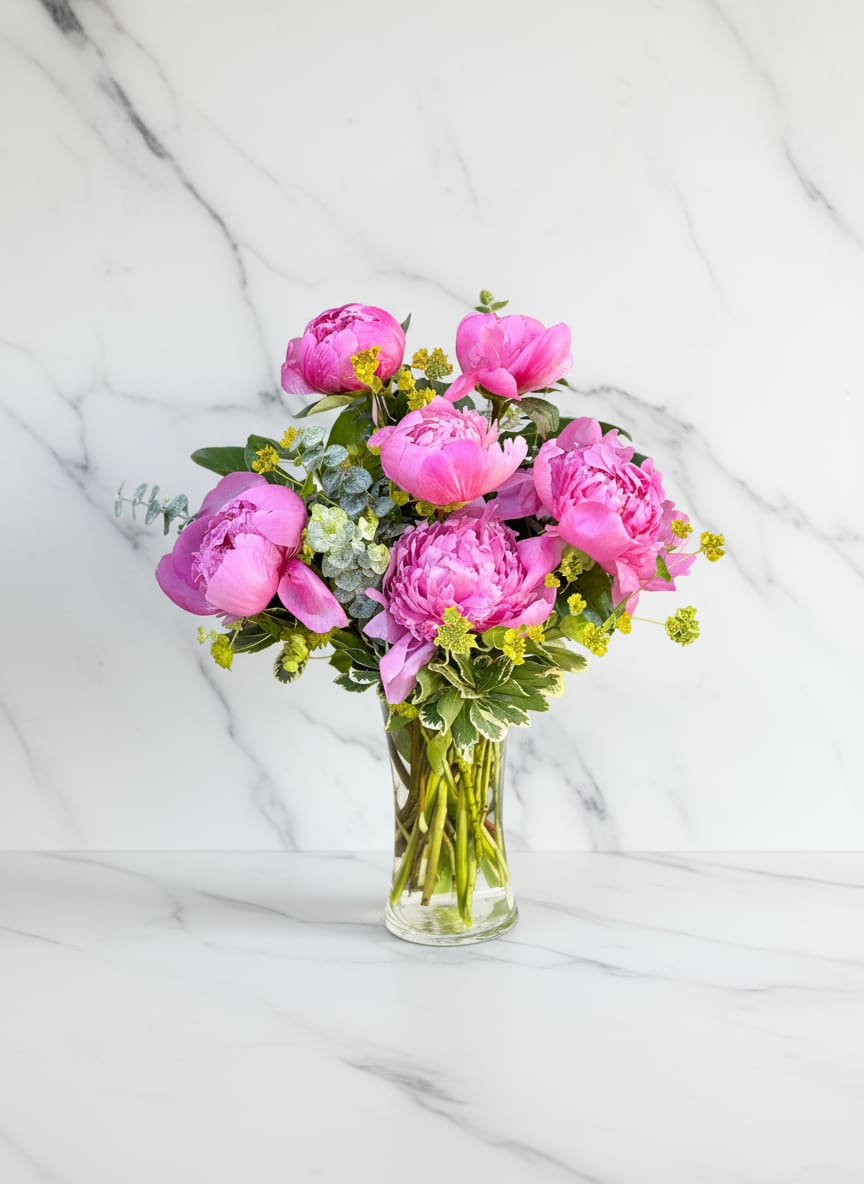 Rosé Peonies - Celebrate the beauty of peony season with a lush arrangement of premium pink peonies gathered in a clear glass vase. Showcasing the full, ruffled blooms and delicate fragrance that make peonies a spring favorite, Rosé Peonies is designed with fresh seasonal greenery for a soft, garden-inspired look. Perfect for birthdays, anniversaries, thank-you gifts, new babies, or simply brightening someone’s day. Handcrafted by Polk Street Florist and available for same-day flower delivery in San Francisco while peonies are in season.