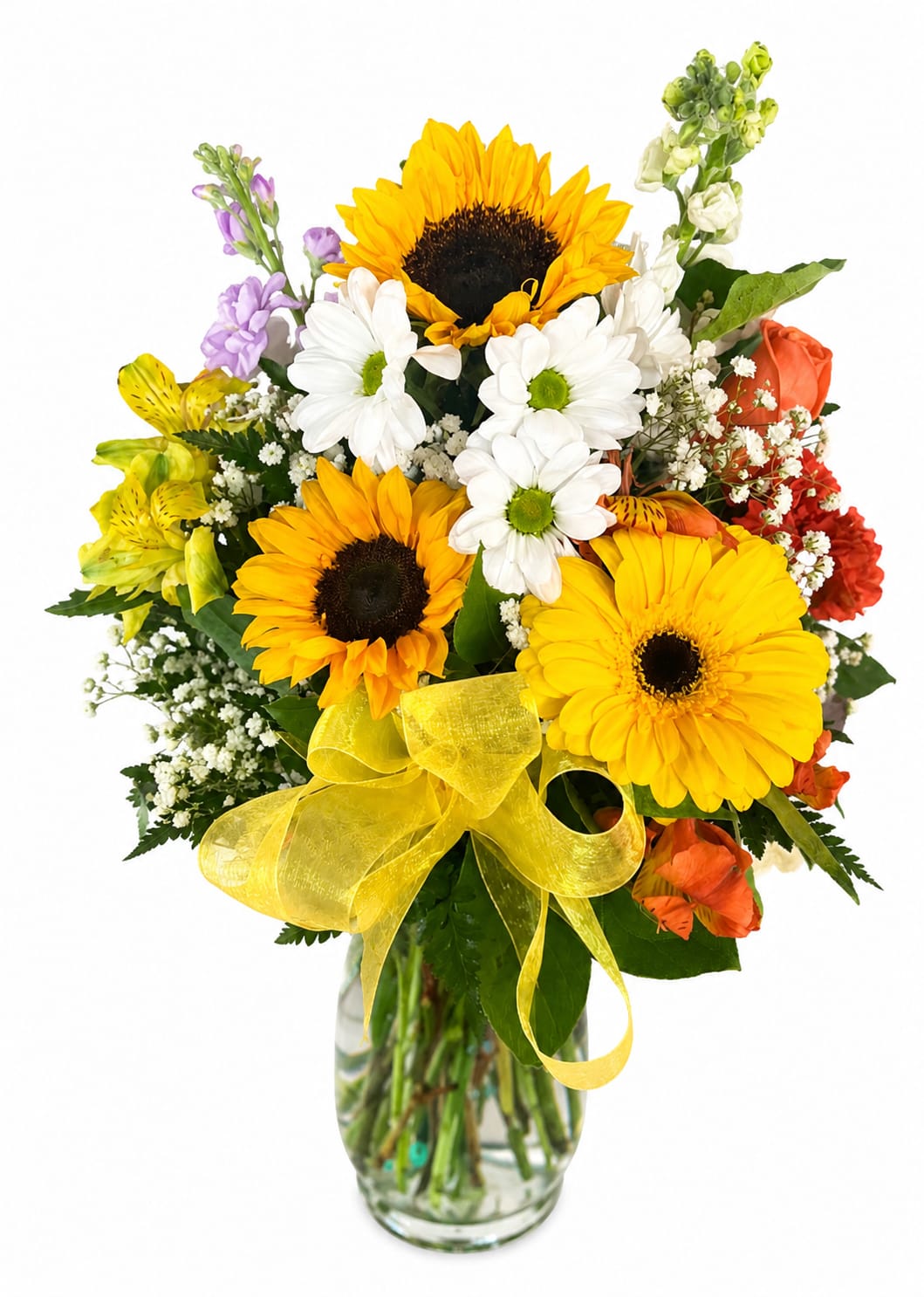Bouquet of sunflowers, daisies, and mixed blooms in a glass vase with a yellow ribbon