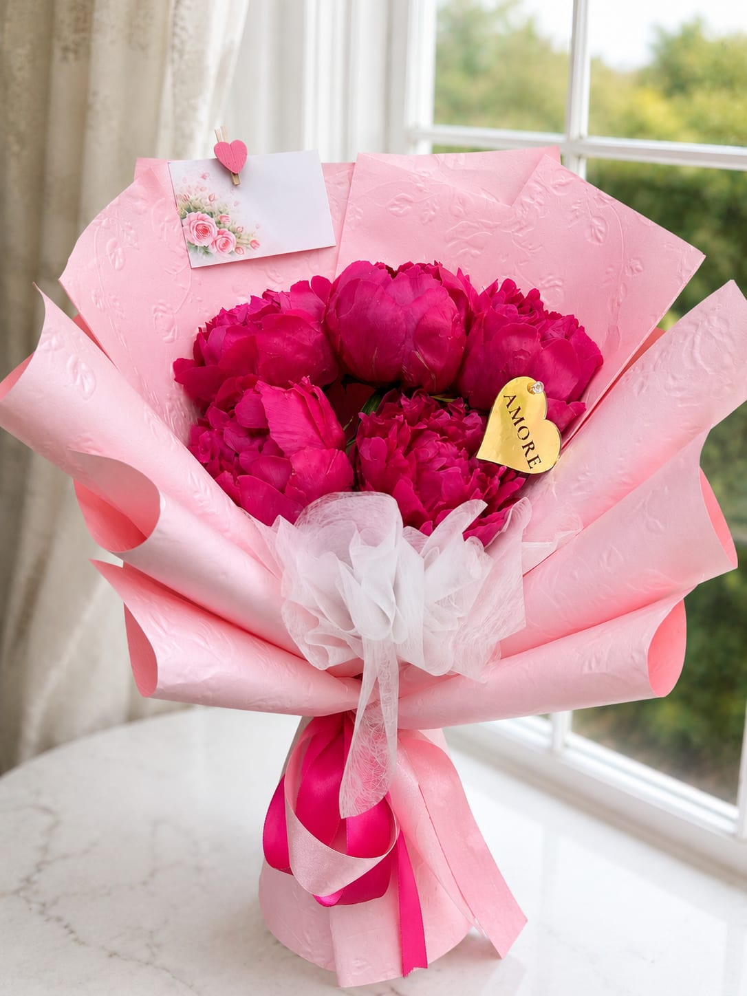 Peony Bouquet – Elegant &amp; Romantic  - Peonies are among the most luxurious and sought-after flowers, known for their large blooms, delicate petals, and romantic beauty.  Our Peony Bouquet is carefully handcrafted using fresh premium peonies and elegant wrapping to create a stunning gift for birthdays, anniversaries, celebrations, or any special occasion.  Each bouquet is designed to highlight the natural beauty of these exceptional blooms, creating an unforgettable floral experience.  Peony colors may vary based on seasonal and market availability. We always select the freshest and most beautiful peonies available to ensure a breathtaking arrangement.  Perfect for: • Birthdays • Anniversaries • Romantic occasions • Congratulations • Luxury floral gifts