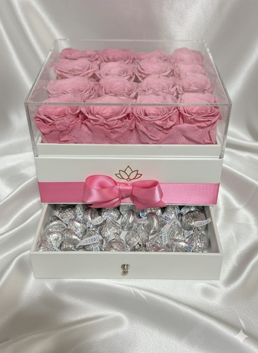 Pink Preserved Rose Jewelry Drawer Box – 16 Roses Luxury Gift Set - Our Pink Preserved Rose Jewelry Drawer Box – 16 Roses Luxury Gift Set features sixteen premium preserved pink roses beautifully arranged in a refined square luxury box with satin ribbon detailing and an integrated jewelry drawer compartment.  This design blends romantic floral presentation with a practical jewelry space, making it ideal for anniversaries, birthdays, proposals, or meaningful surprises.  The soft pink roses symbolize admiration, grace, and affection. Preserved roses maintain their beauty for months — even years — with proper care, offering a long-lasting and elegant alternative to fresh flowers.  A sophisticated and charming gift set designed to create unforgettable moments. 
