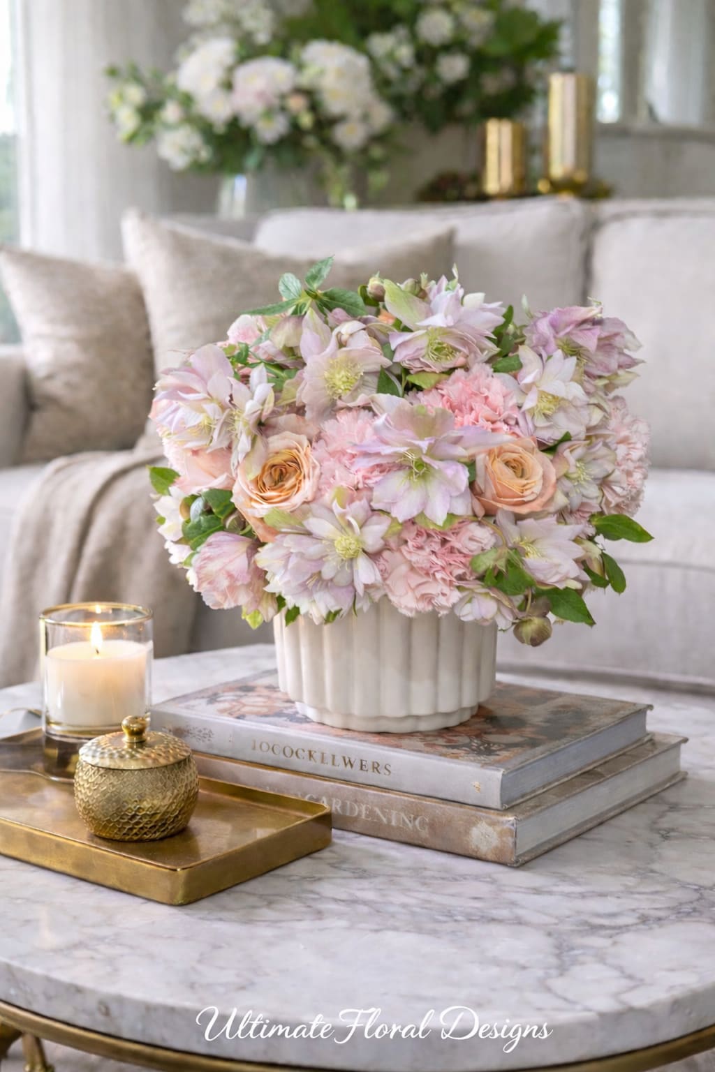 Blush and cream floral arrangement in a white vase on a table