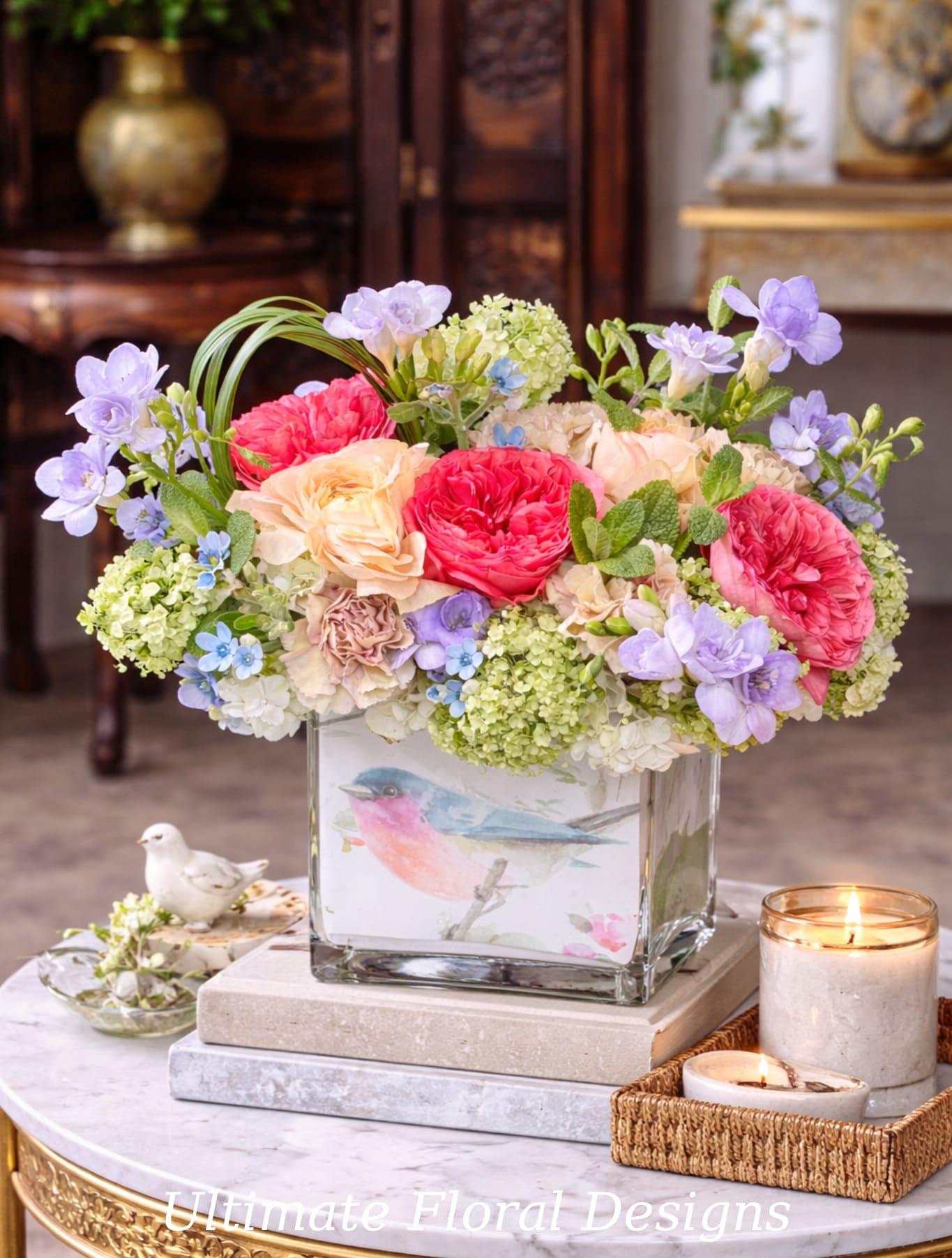 Spring Garden Grace - Spring Garden Grace is a fresh, garden-inspired floral arrangement featuring peach garden roses, blush carnations, delicate freesia, and seasonal accent blooms arranged in a clear glass vase. The soft spring palette and natural, airy design create an elegant composition that brings warmth and beauty to any home or office. Perfect for everyday enjoyment, birthdays, or thoughtful gifting.  Each arrangement is handcrafted with premium flowers by Ultimate Floral Designs, a luxury florist in Great Falls, Virginia, proudly serving McLean, Arlington, Washington DC, Bethesda, and Northern Virginia with refined floral designs and exceptional quality.