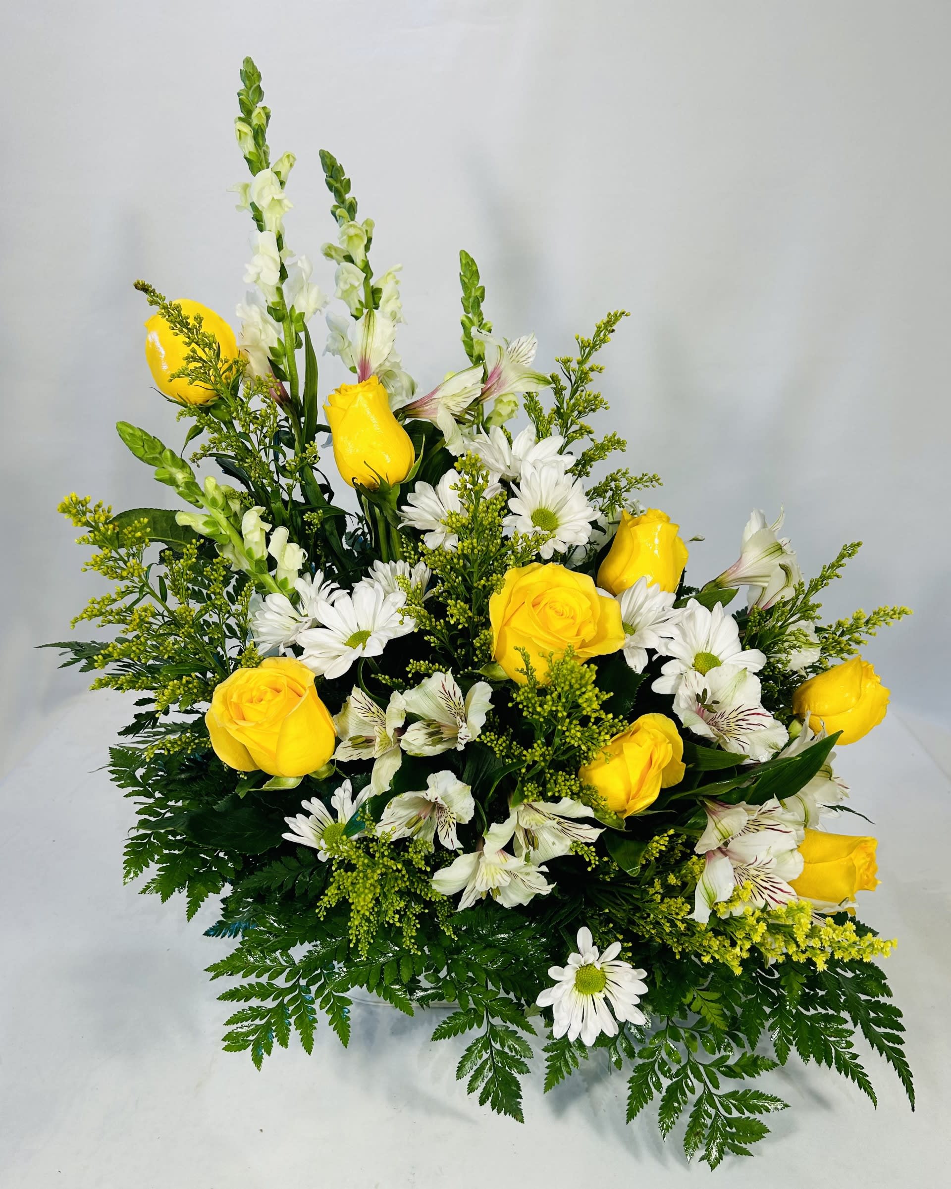 Peaceful Thoughts  - This yellow and white arrangement features yellow roses and white snapdragons accented with yellow solidago and white blooms in a beautiful white keepsake container.  Arrangement is perfect for any occasion. 