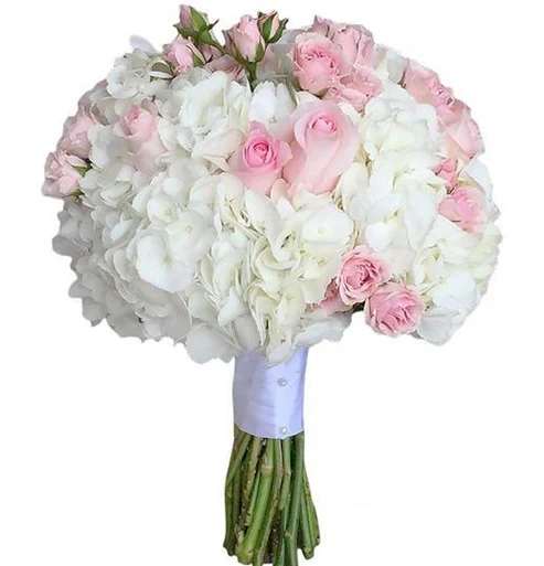 Hydrangea &amp; Pink Roses Wedding Bouquet - Hydrangea and roses are always a favorite flower and the most popular choice when it comes to wedding flowers. The combination of these two flowers is a lush and wonderful composition and makes a great option for any wedding style.