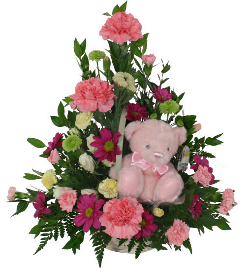 Pink and magenta flower arrangement with a pink teddy bear
