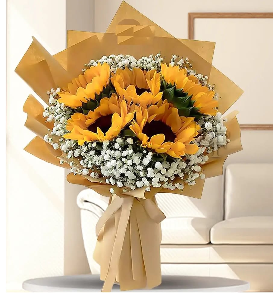 Bouquet of sunflowers wrapped in tan paper with white filler flowers