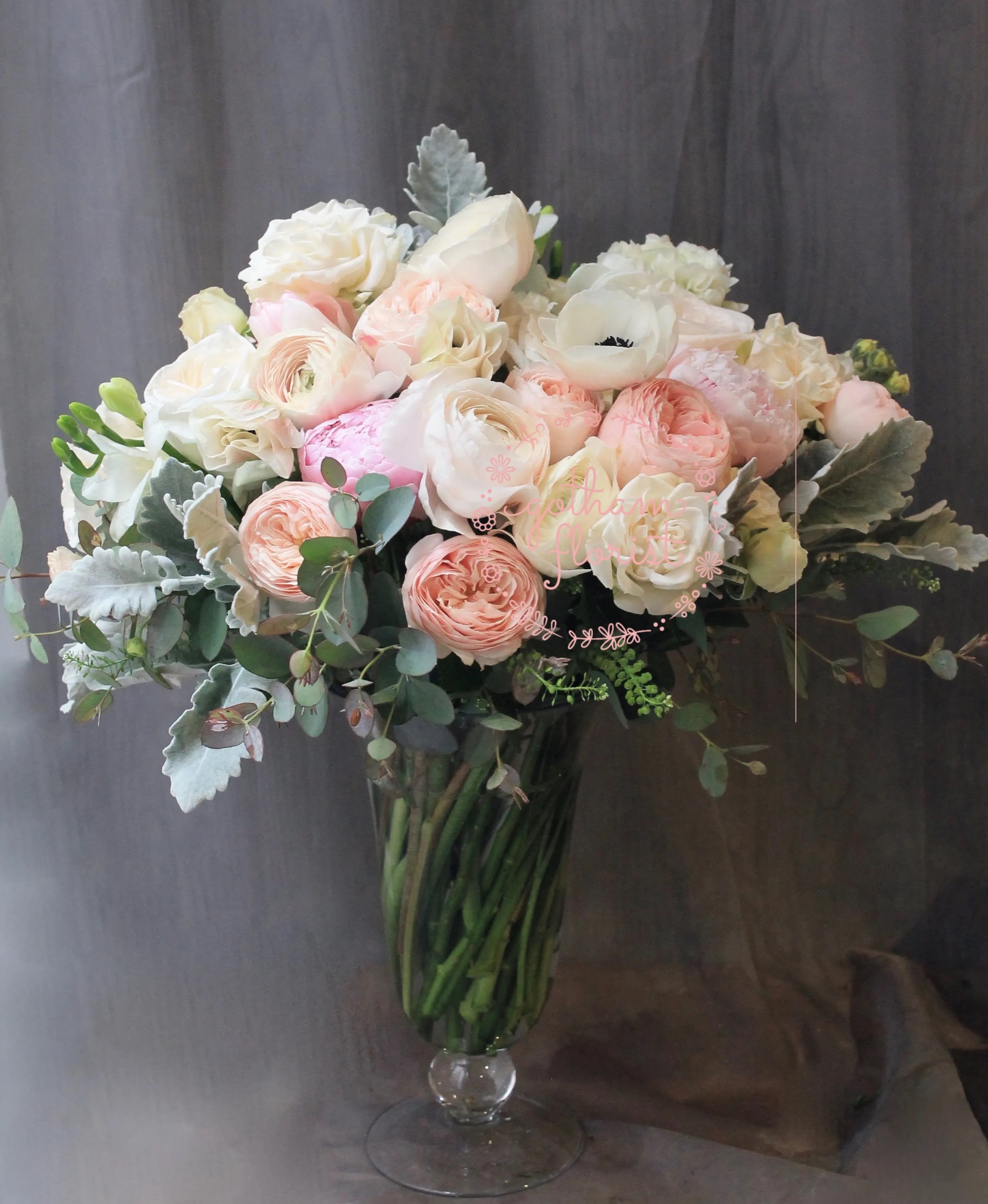 Faith - Delicate white and pink blooms in pretty glass pedestal vase. Luxurious and whimsical.Send the best flowers from the best flower shop in New York. We offer same day flower delivery in Manhattan, Queens, Bronx, Brooklyn, Staten Island and West Chester counties. We have the prettiest and most luxurious flowers to choose from and our designs are unique and whimsical. We carry Peonies almost every day of the year!!#mercuryvase #weddingflowers #luxuryflowers #ranunculus #peony #peonies #flowerdelivery #samedaydelivery