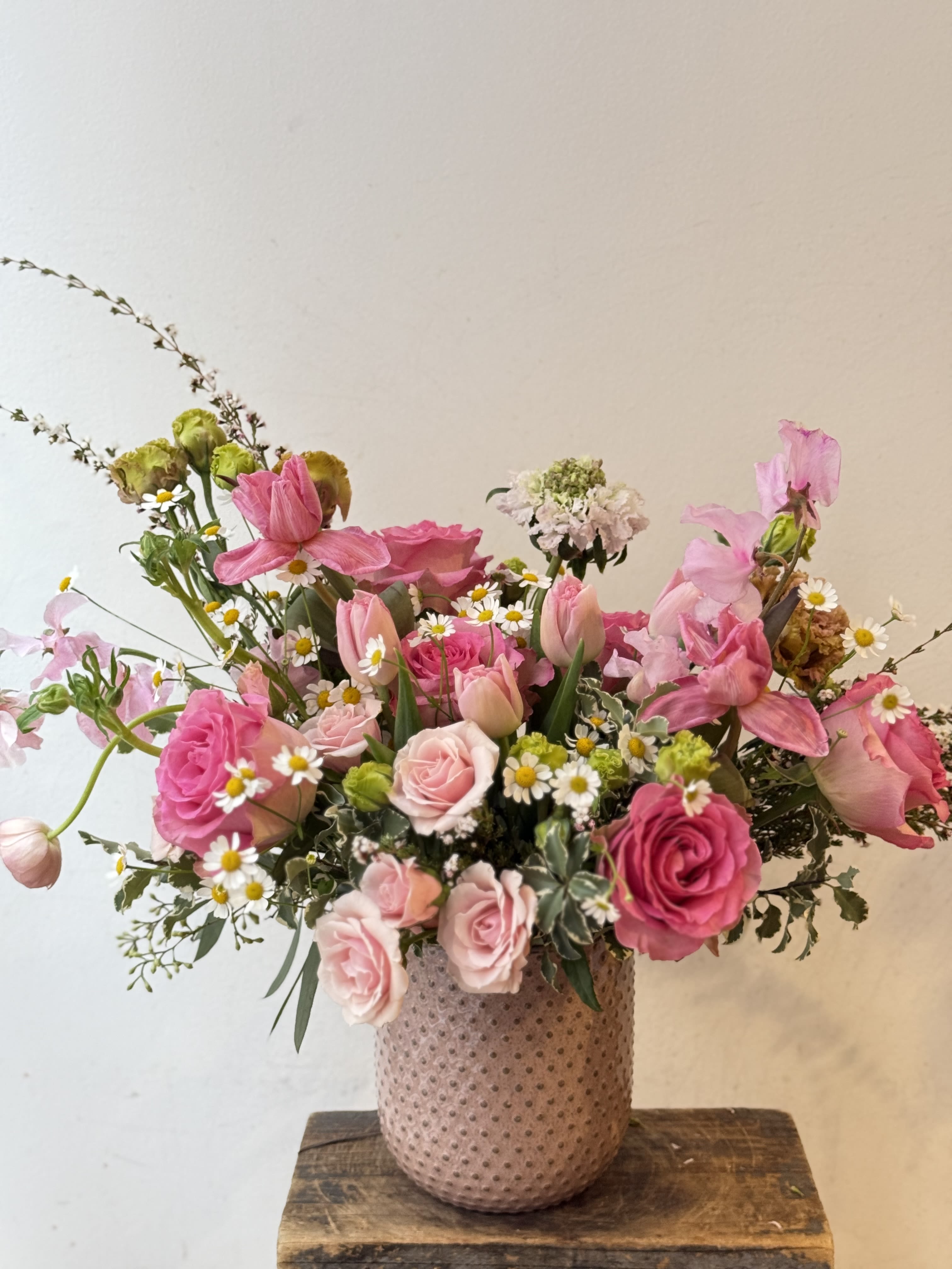 Pink and white mixed bouquet in a textured vase