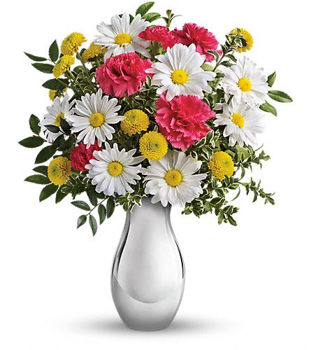 Bouquet of white daisies, pink carnations, and yellow button flowers in a silver vase