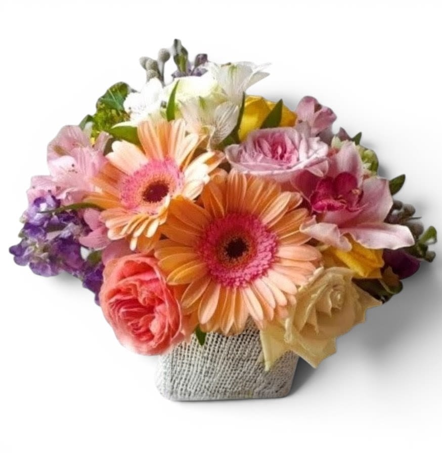 Blush Vanilla Birthday Bouquet Designer's Choice - Send this beautiful bouquet today to make them smile with it's lovely mixed vanilla and blush blossoms of the day roses hydrangeas and more arranged in a modern glass cube vase. Always made unique and extra special each time. Send happiness.