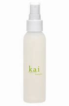 A white spray bottle with a green kai label