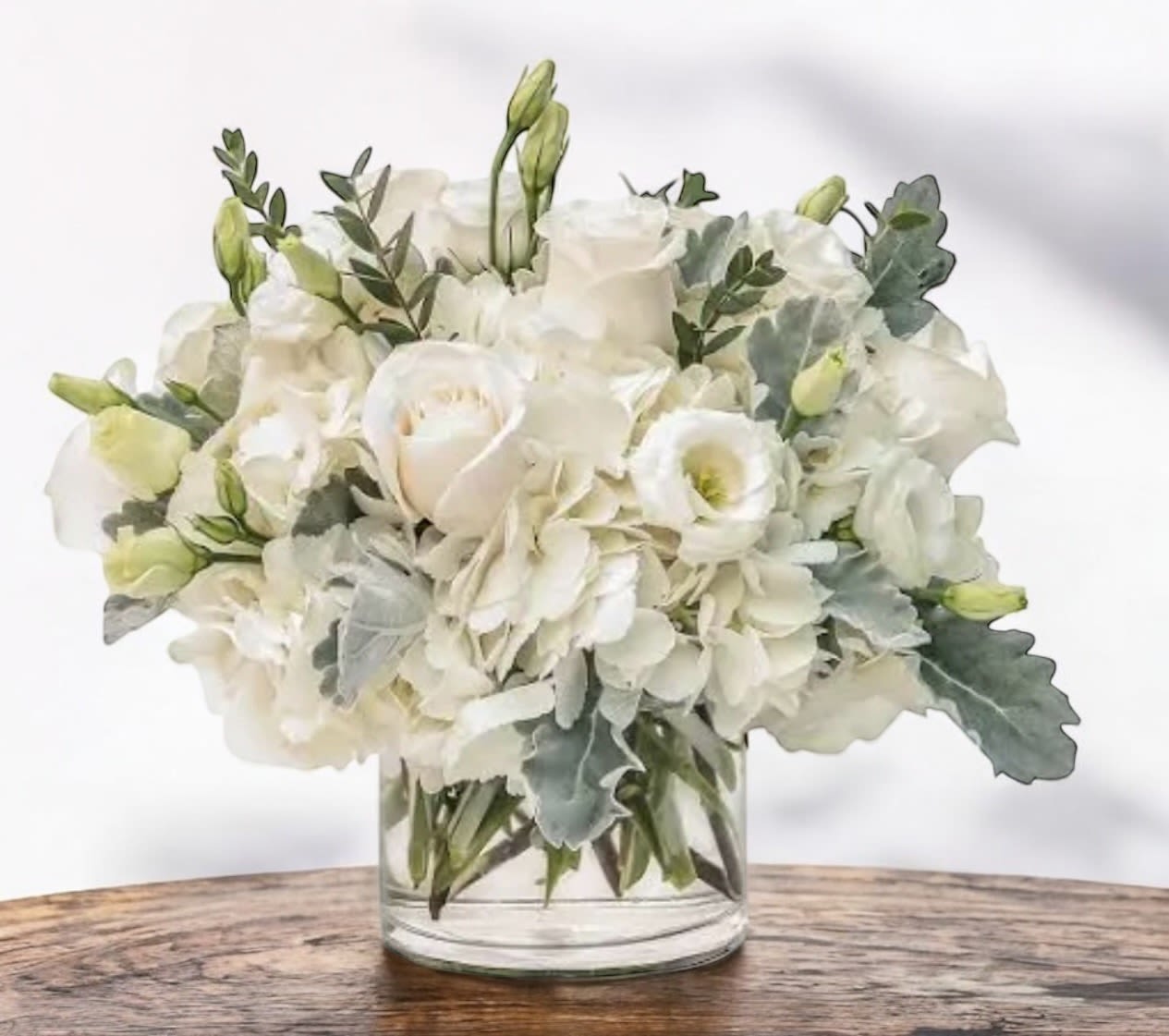 White floral bouquet in a clear glass vase
