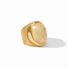 Verona Statement Ring - Gold Julie Voss Verona Statement Ring with Iridescent Champagne colored stone.   Discover the art of giving at Petals, Wilmington, Delaware’s destination for luxury gifts and home décor. Our curated collection features beautifully crafted items for every occasion — birthdays, weddings, anniversaries, holidays, and life’s special celebrations. At Petals, we believe every gift should tell a story. From hand-poured candles and elegant keepsakes to stylish home accents, gourmet treats, and floral-inspired décor, our selection combines timeless charm with modern sophistication. Each piece is chosen with care to reflect the quality, creativity, and personal touch our Wilmington customers love.  Same-day delivery available throughout Wilmington and nearby areas including Greenville, Hockessin, Newark, and the Brandywine Valley Whether you’re looking for a thoughtful hostess gift, a luxury home accent, or something simply beautiful to brighten someone’s day, Petals offers fine gifts and personalized service that make every occasion memorable. Visit our Wilmington boutique or shop online today — and see why Petals is Delaware’s trusted name for fine gifts and inspired giving.