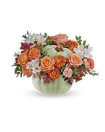Pumpkin-shaped vase with orange and white flowers