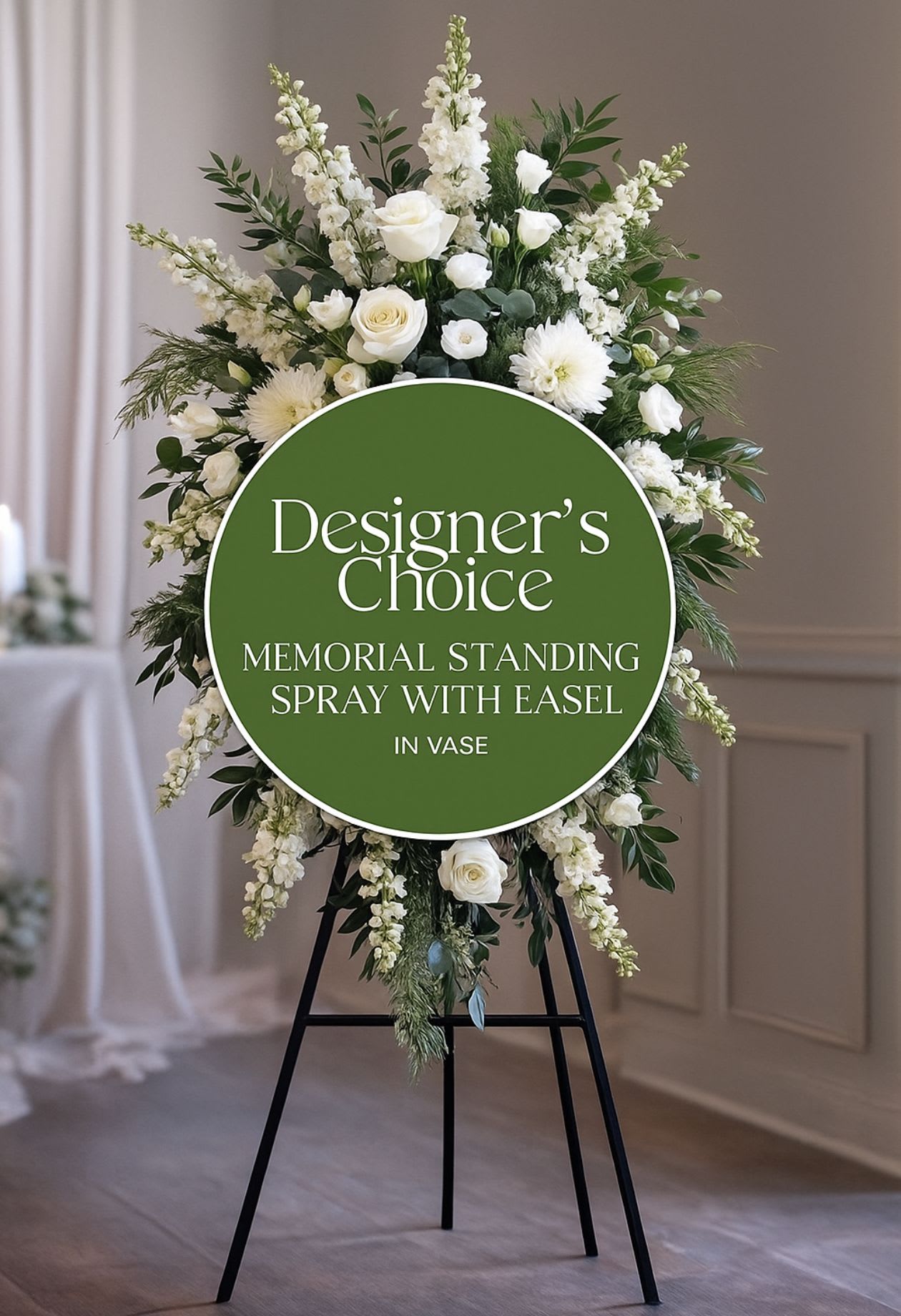 White standing funeral spray on a black easel
