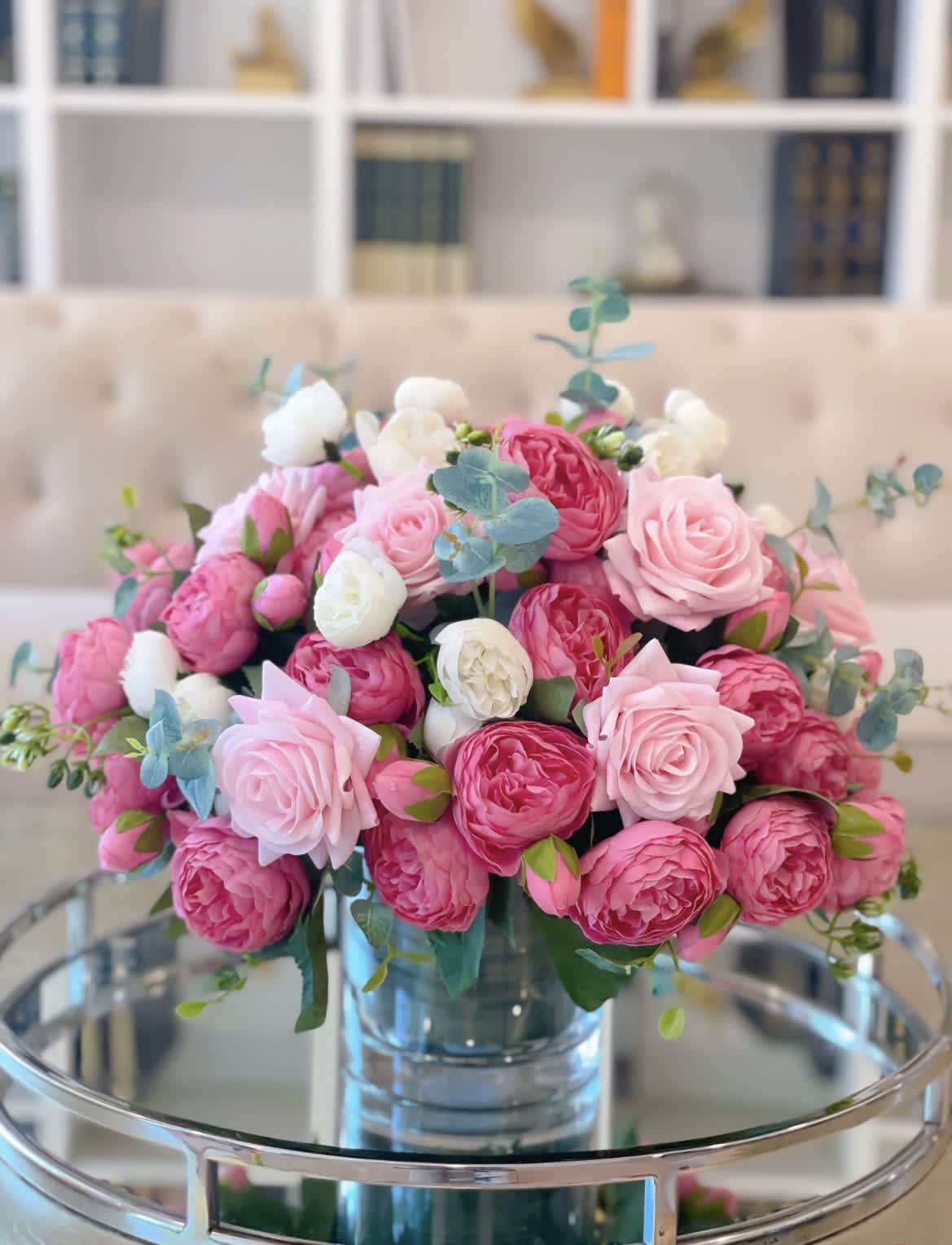 Pink and white rose bouquet in a clear glass vase