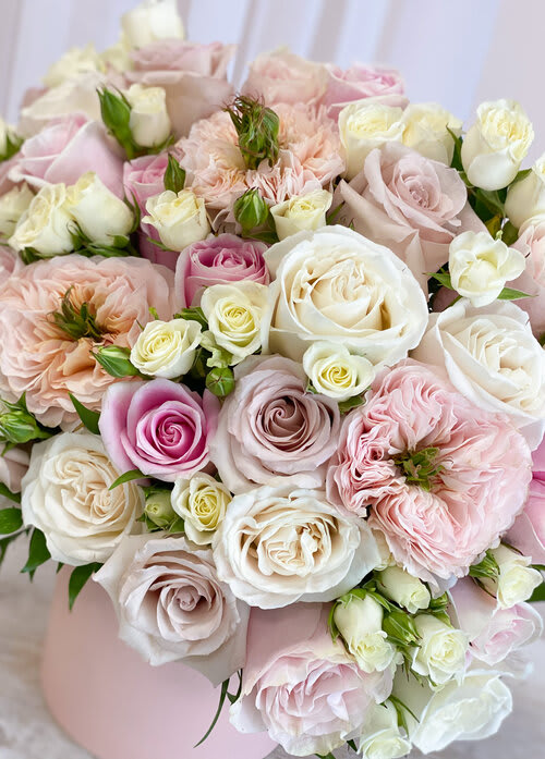 Bouquet of pale pink and white roses with blush blooms