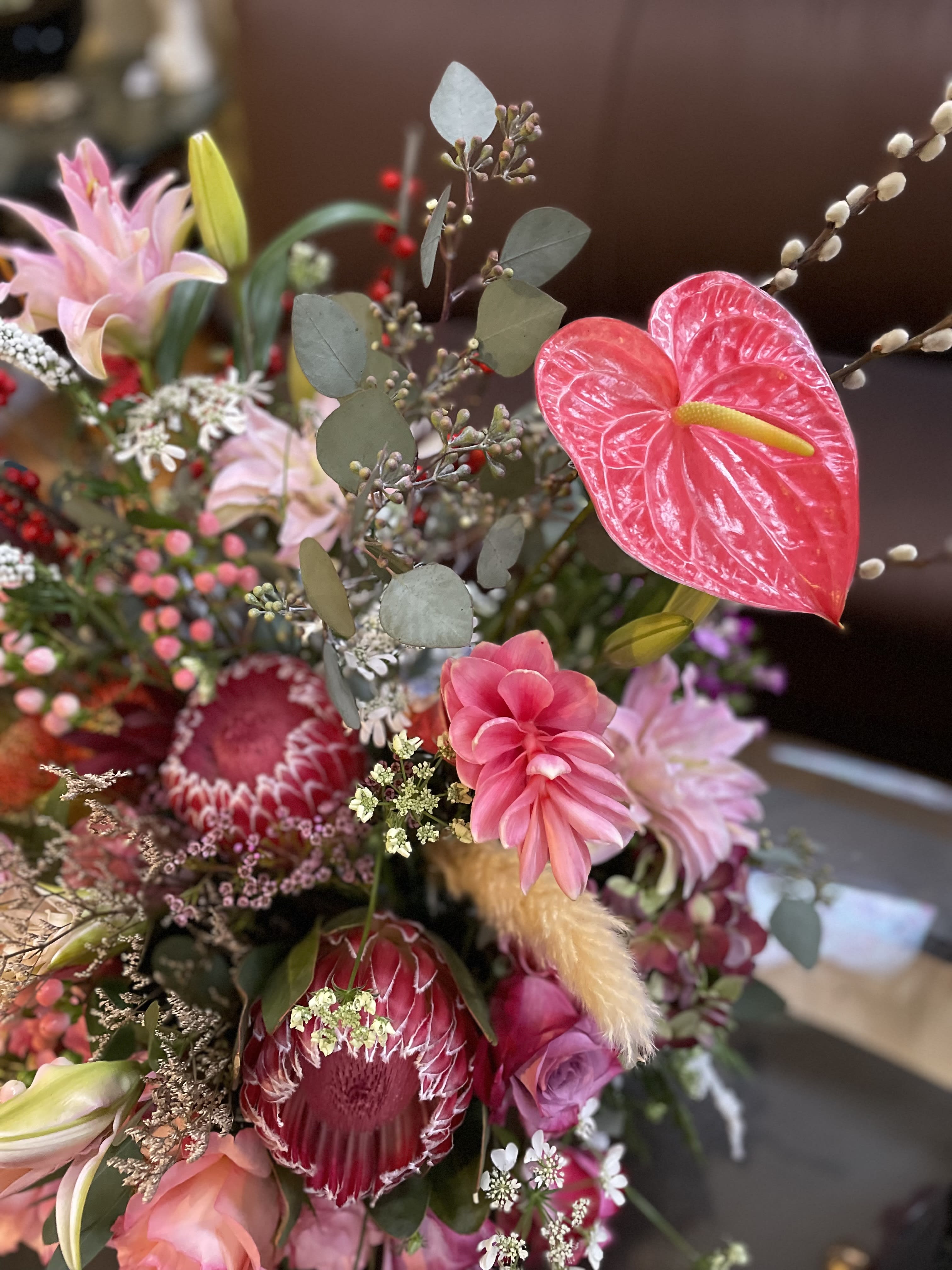 Pink and red mixed bouquet with lilies, protea, and anthurium