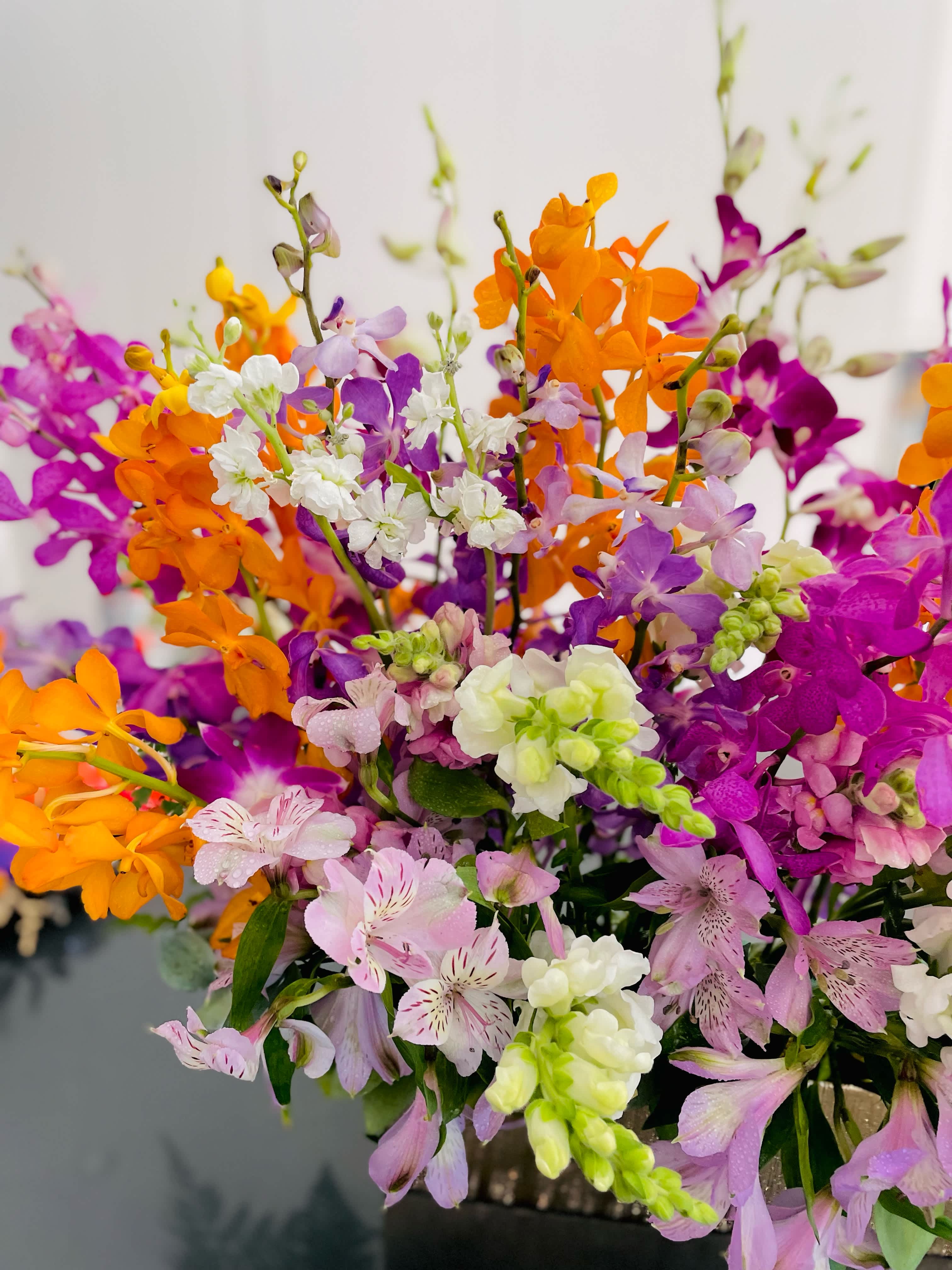 Bright bouquet of purple, orange, pink, and white flowers