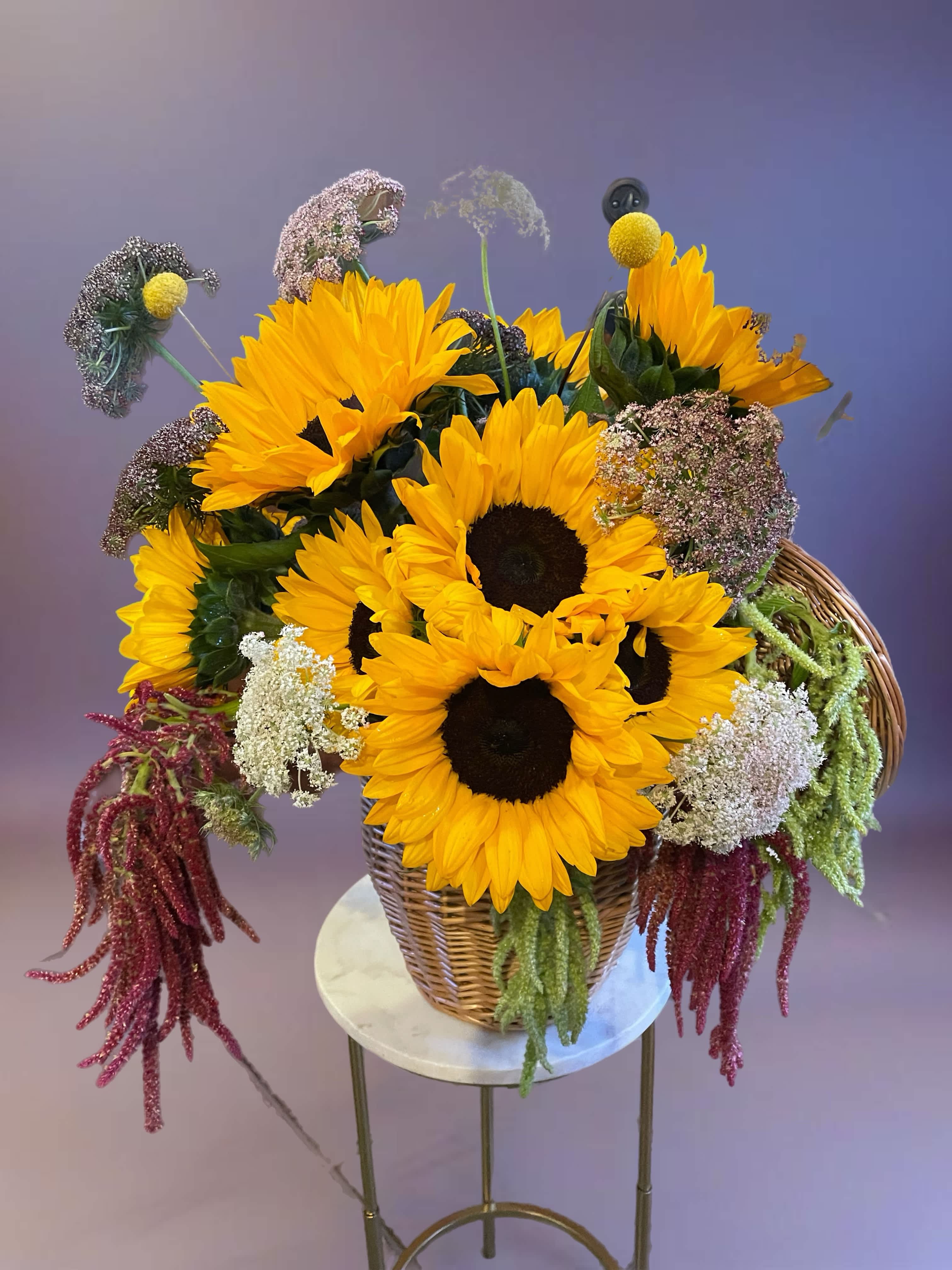 Basket arrangement of sunflowers with mixed filler flowers
