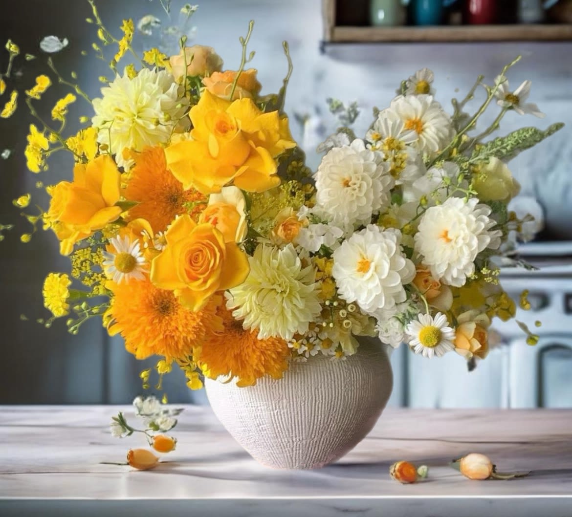 Yellow and white flower arrangement in a textured vase