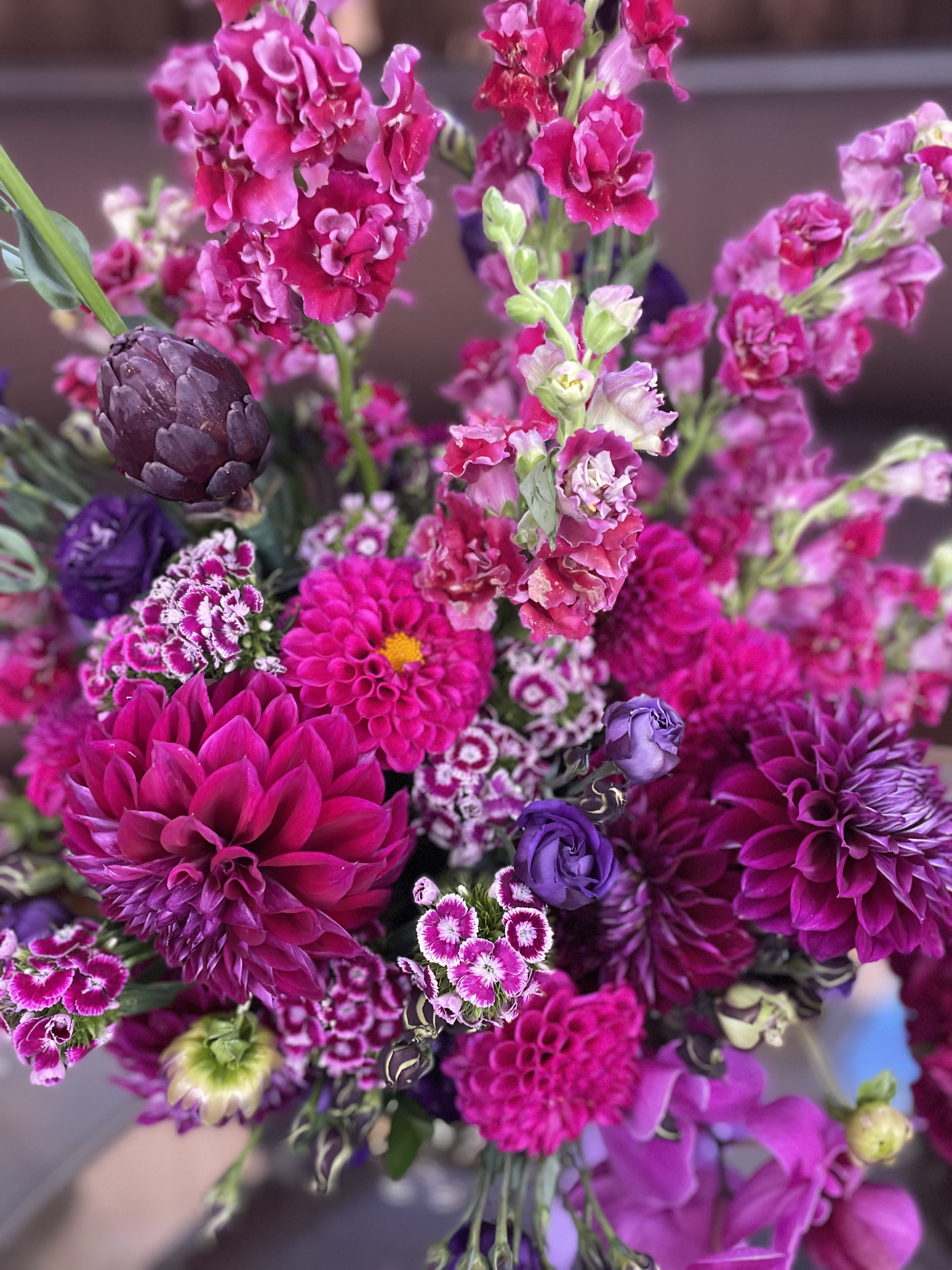 Bouquet of bright pink and purple flowers with mixed textures