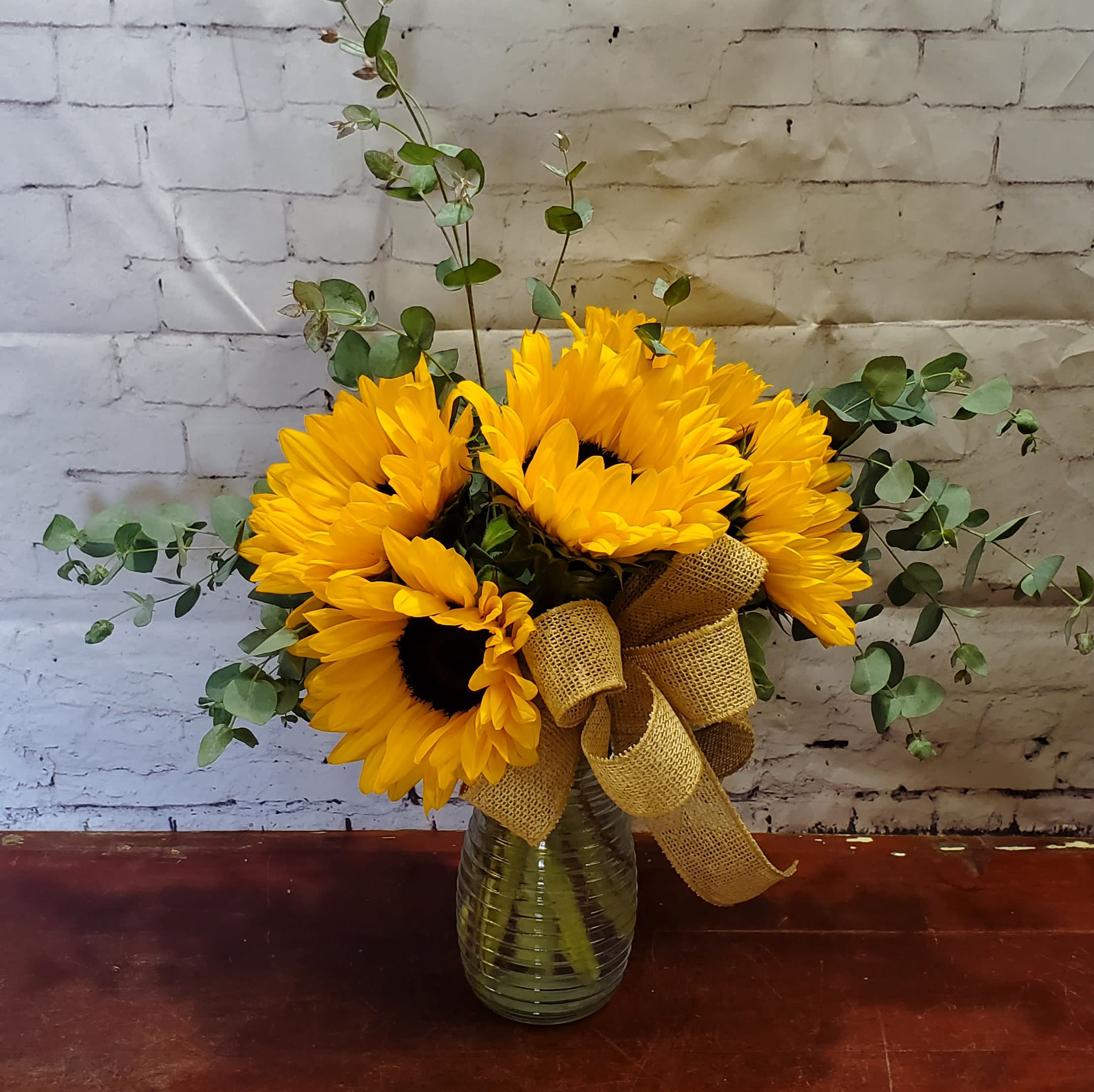 Sunshine Sunflowers - Whoever receives this fun bouquet is sure to be bowled over by its bold beauty! It's big on fun and big on flowers. 